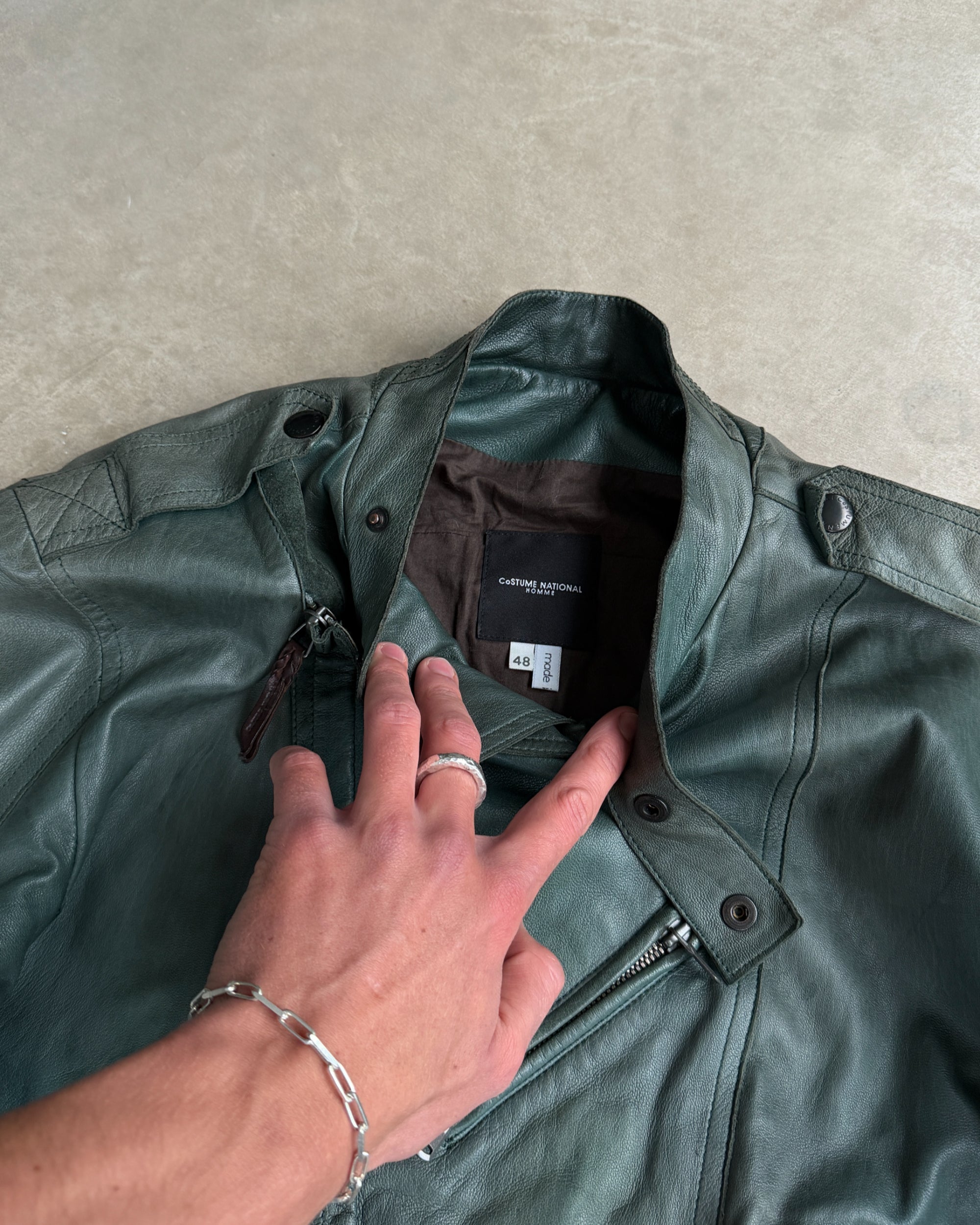 Costume National Homme Green Leather Biker Jacket – M-on a concrete background