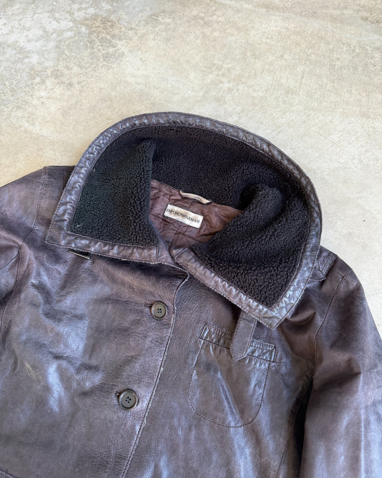 Emporio Armani Brown Funnel Neck Leather Jacket – S/M-on a concrete background