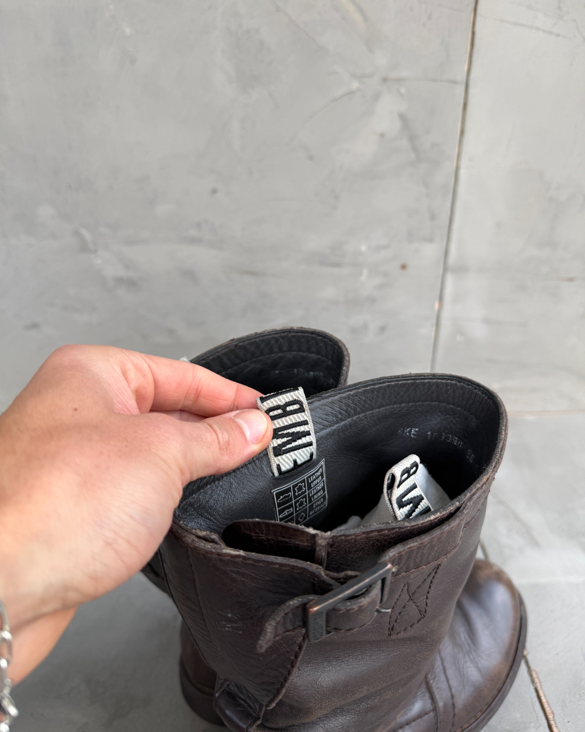 Bikkembergs Slushy Leather Boots with Buckle – EU 36-on a concrete background