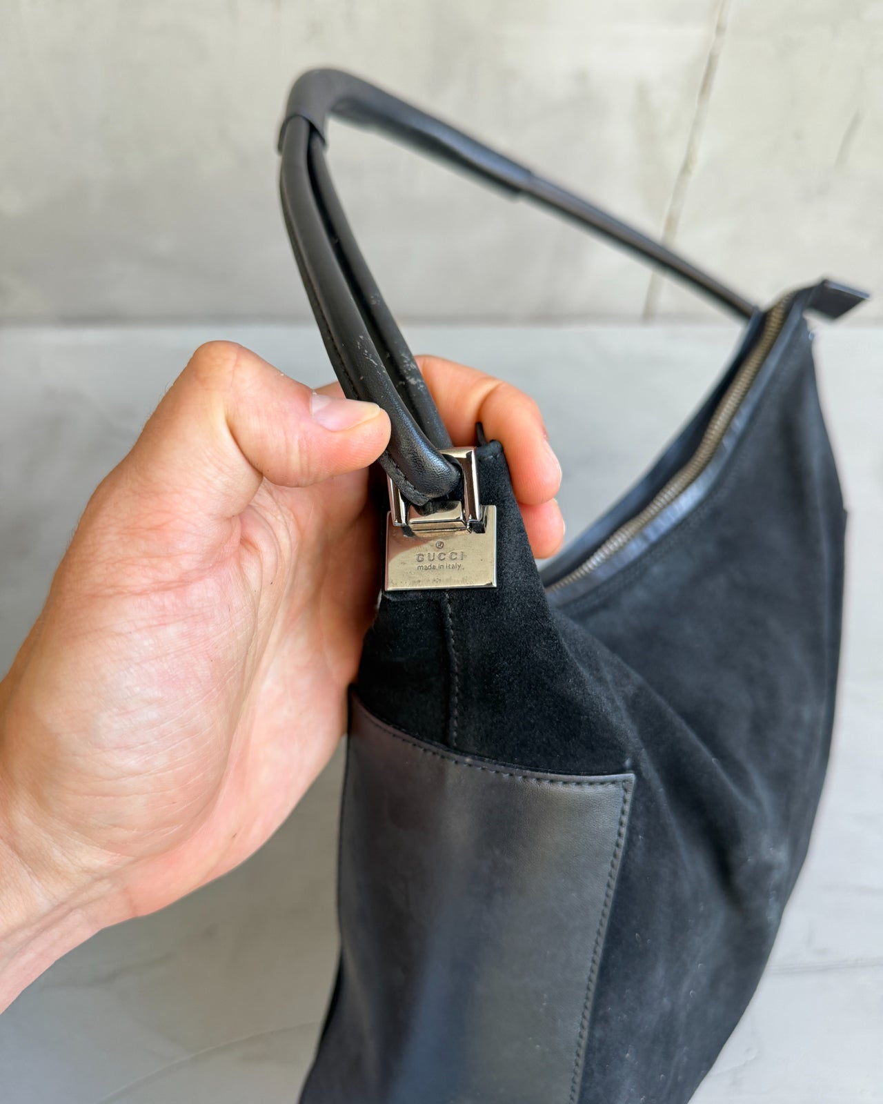 Gucci by Tom Ford Black Leather and Suede Shoulder Bag-on a concrete background