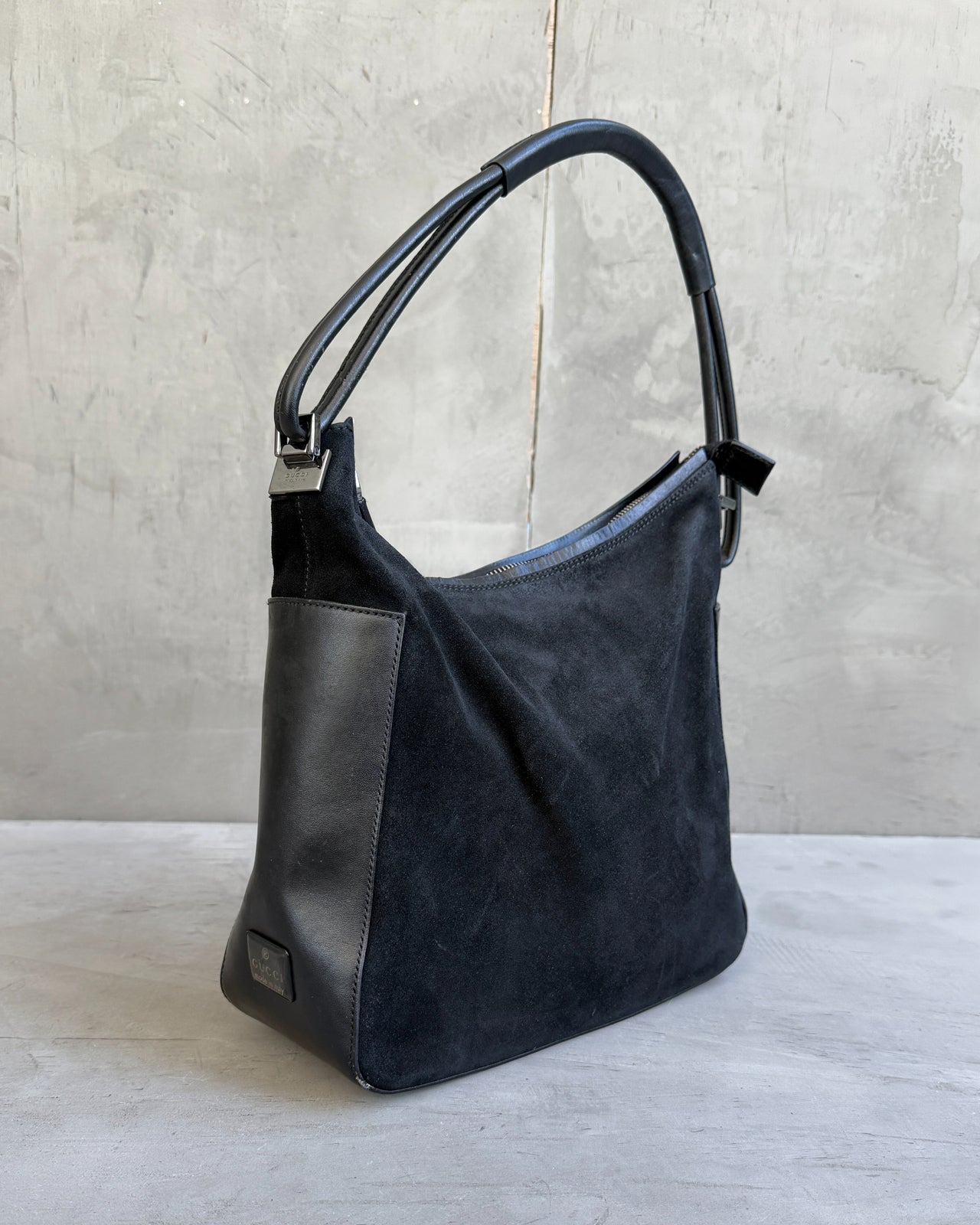 Gucci by Tom Ford Black Leather and Suede Shoulder Bag-on a concrete background
