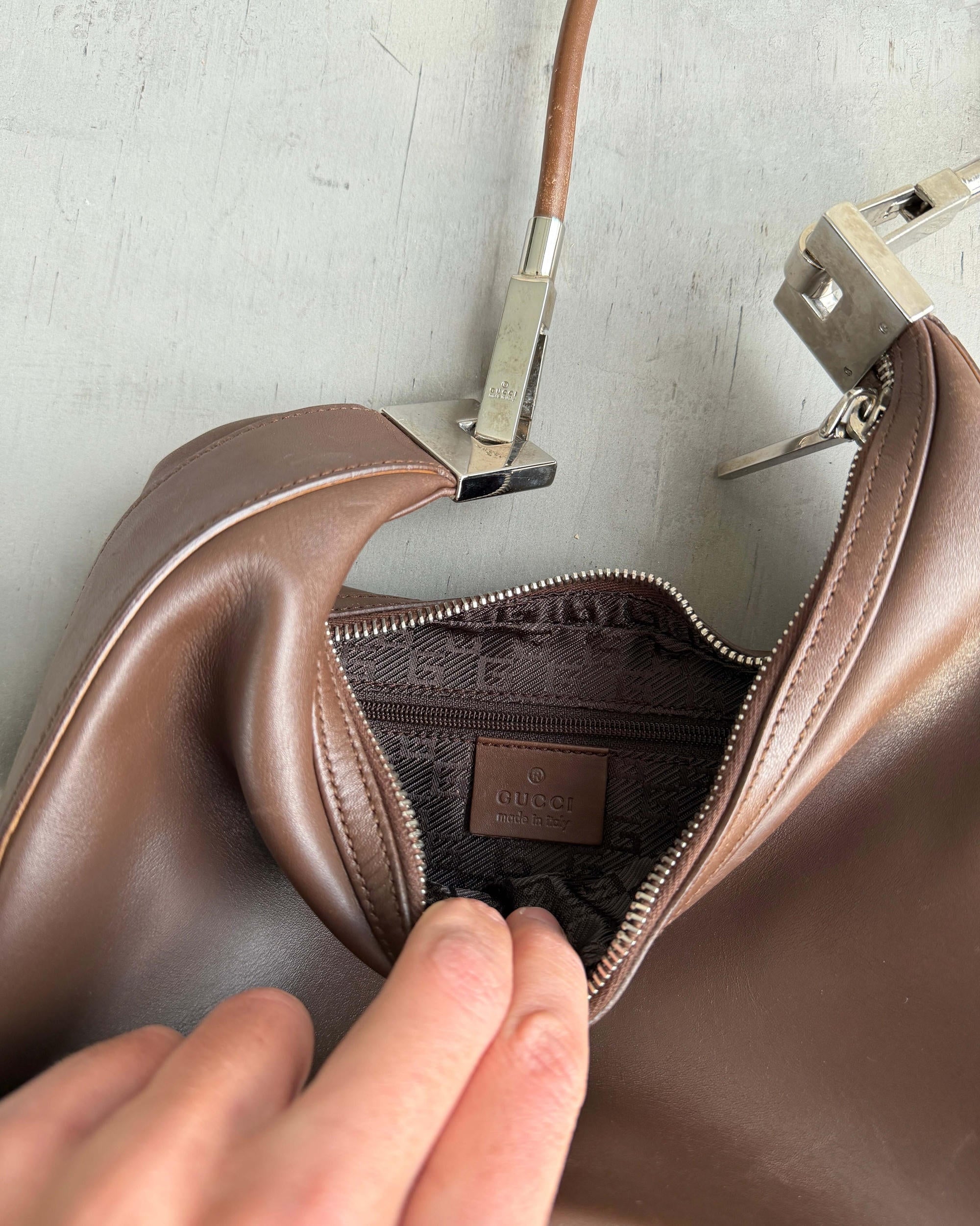 Gucci Asymmetric Structured Leather Shoulder Bag-on a concrete background