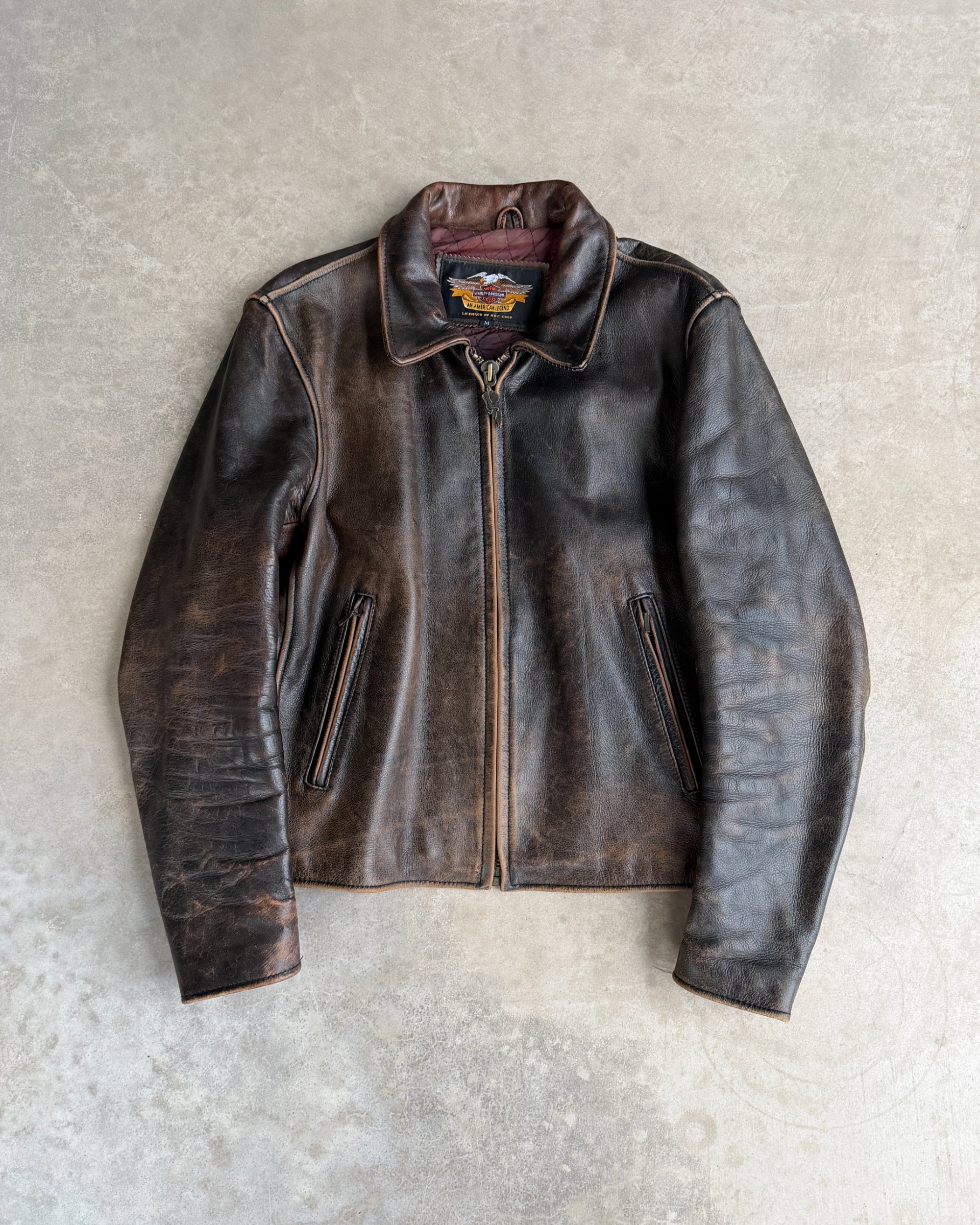 Harley Davidson 1990s Leather Jacket – M-on a concrete background