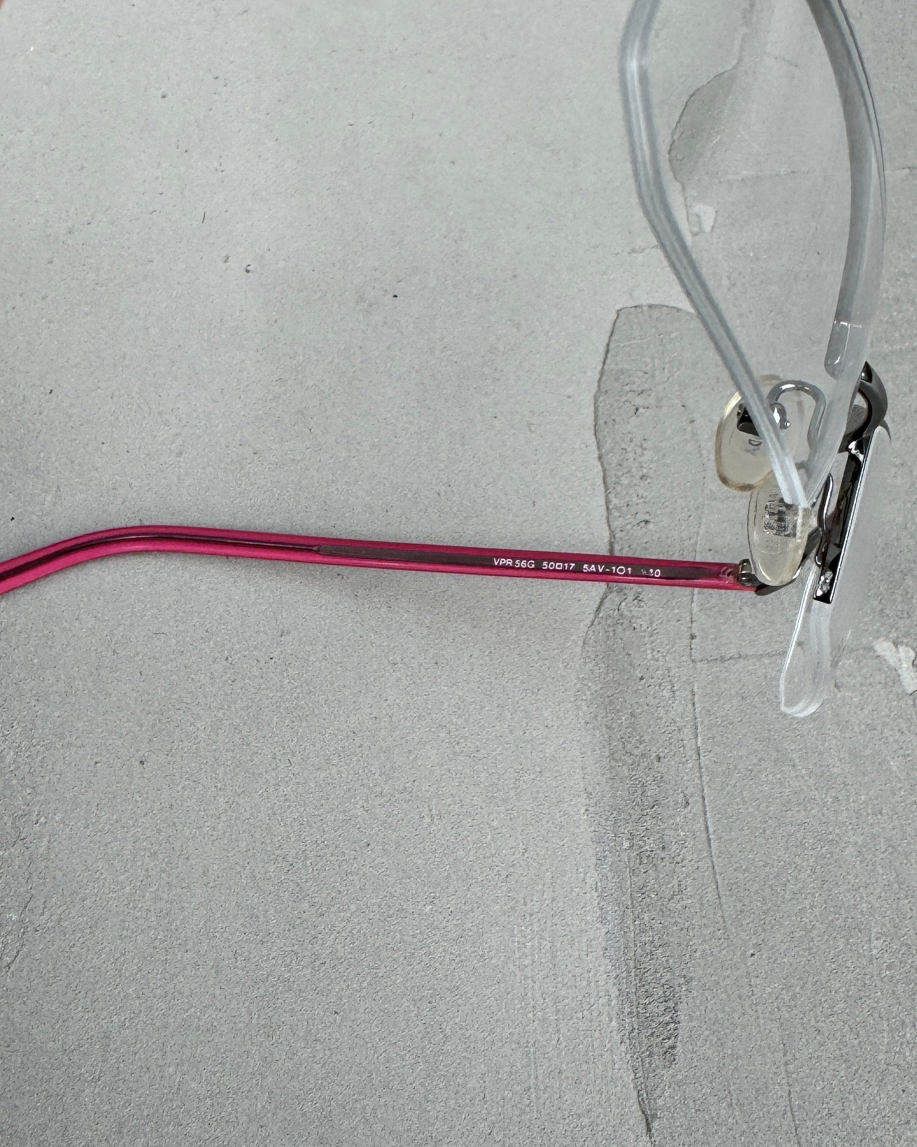 PRADA CLEAR LENS RIMLESS BAYONETTA EYE GLASSES