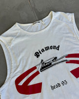 White sleeveless shirt with red and black graphics on a gray surface