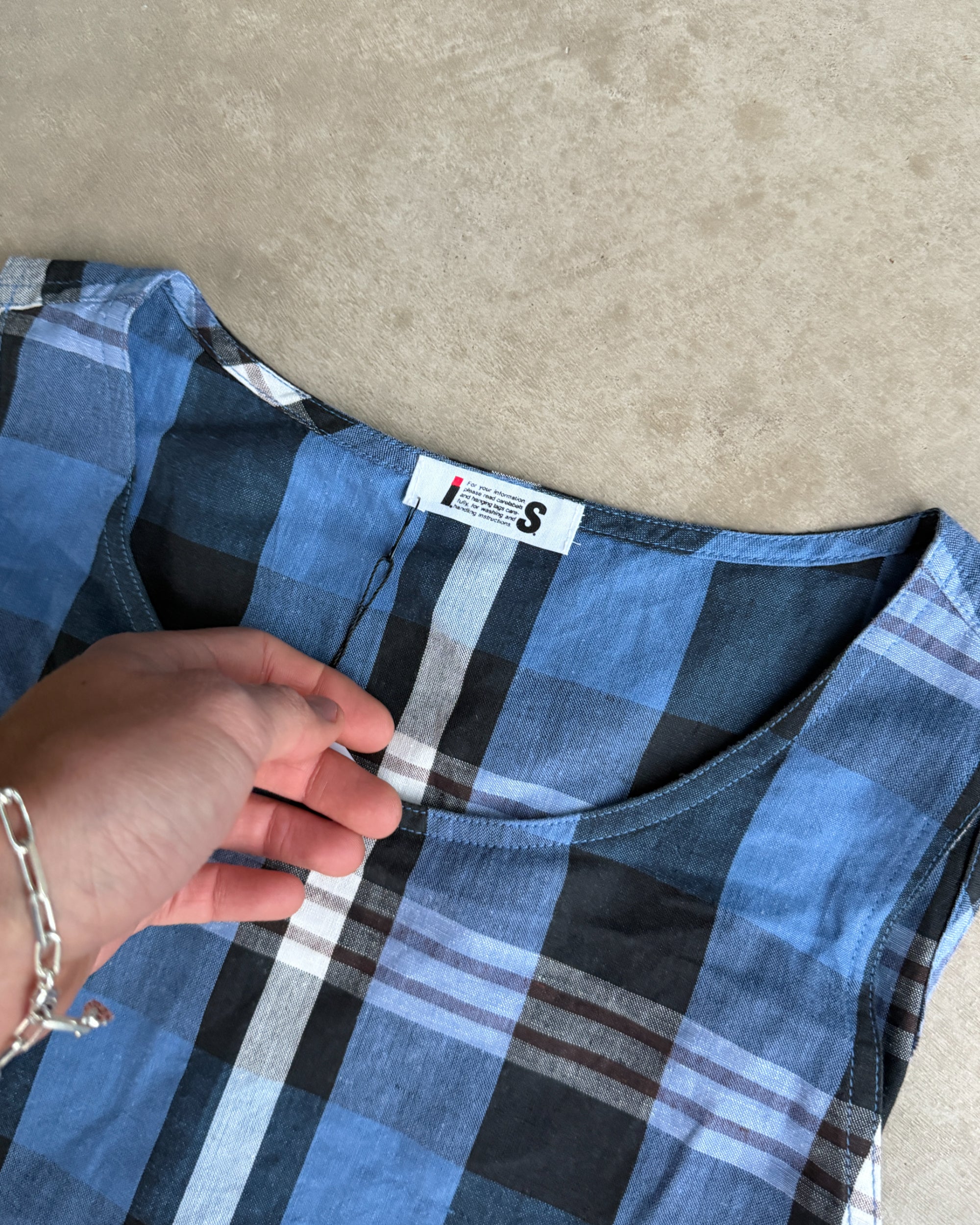 Issey Miyake IS Checkered Dress – M-on a concrete background