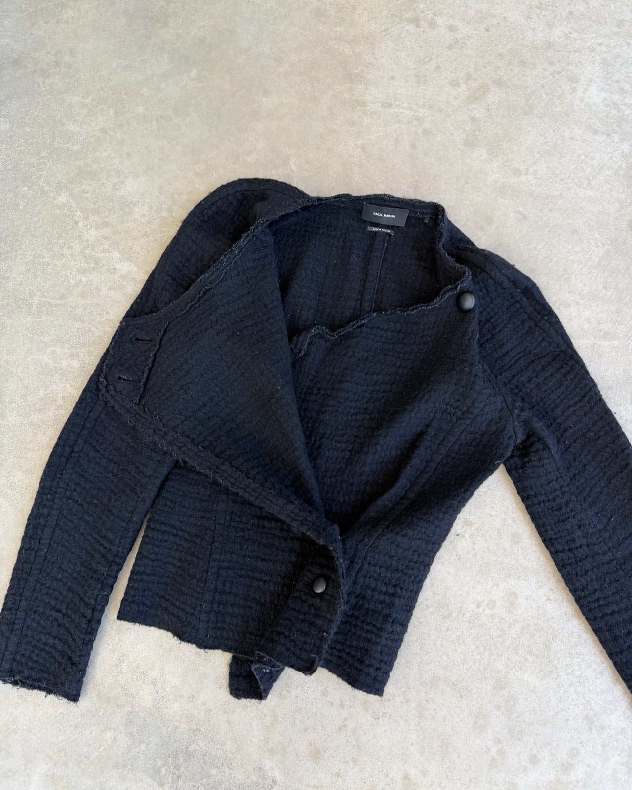 Isabel Marant Asymmetric Black Wool Jacket – S-on a concrete background