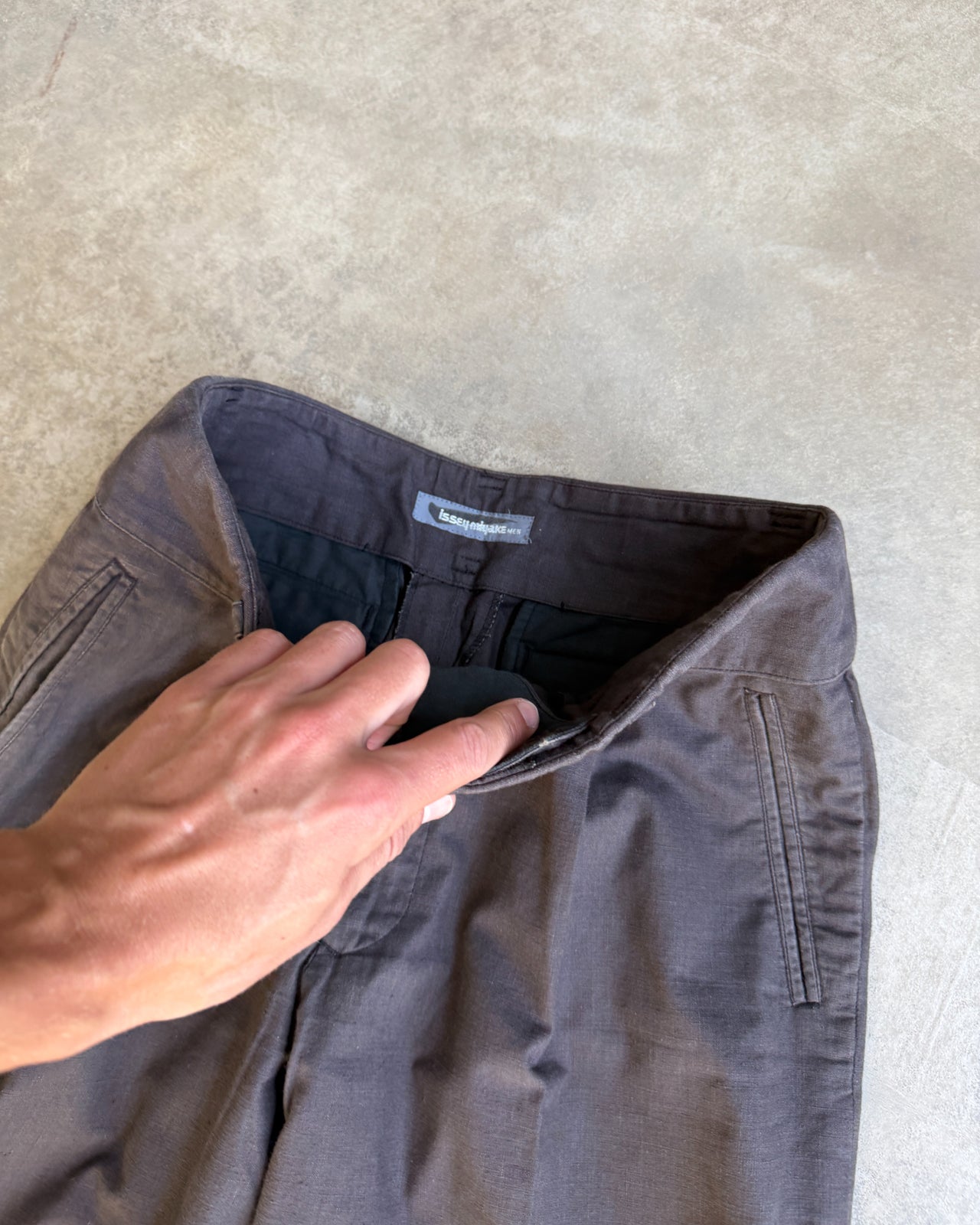 Issey Miyake Men Linen Blend Wide Leg Trousers – M-on a concrete background