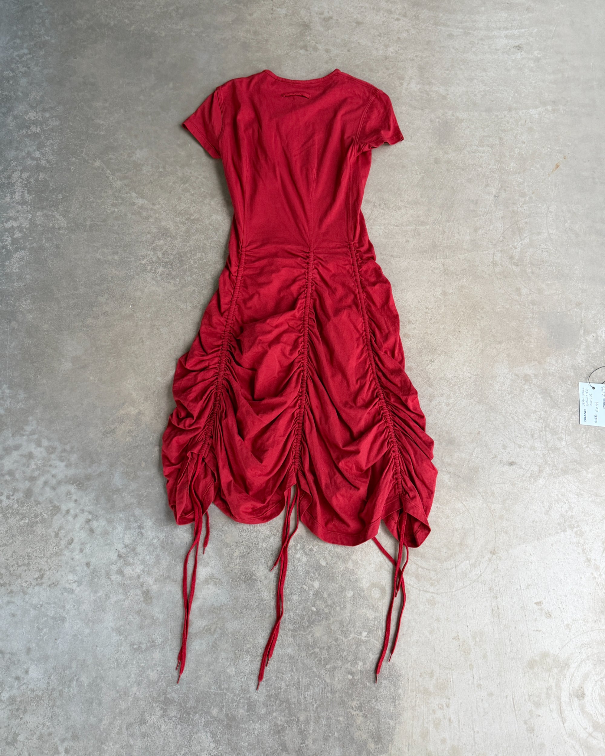 Jean Paul Gaultier Maille Ruched Red Dress – L-on a concrete background