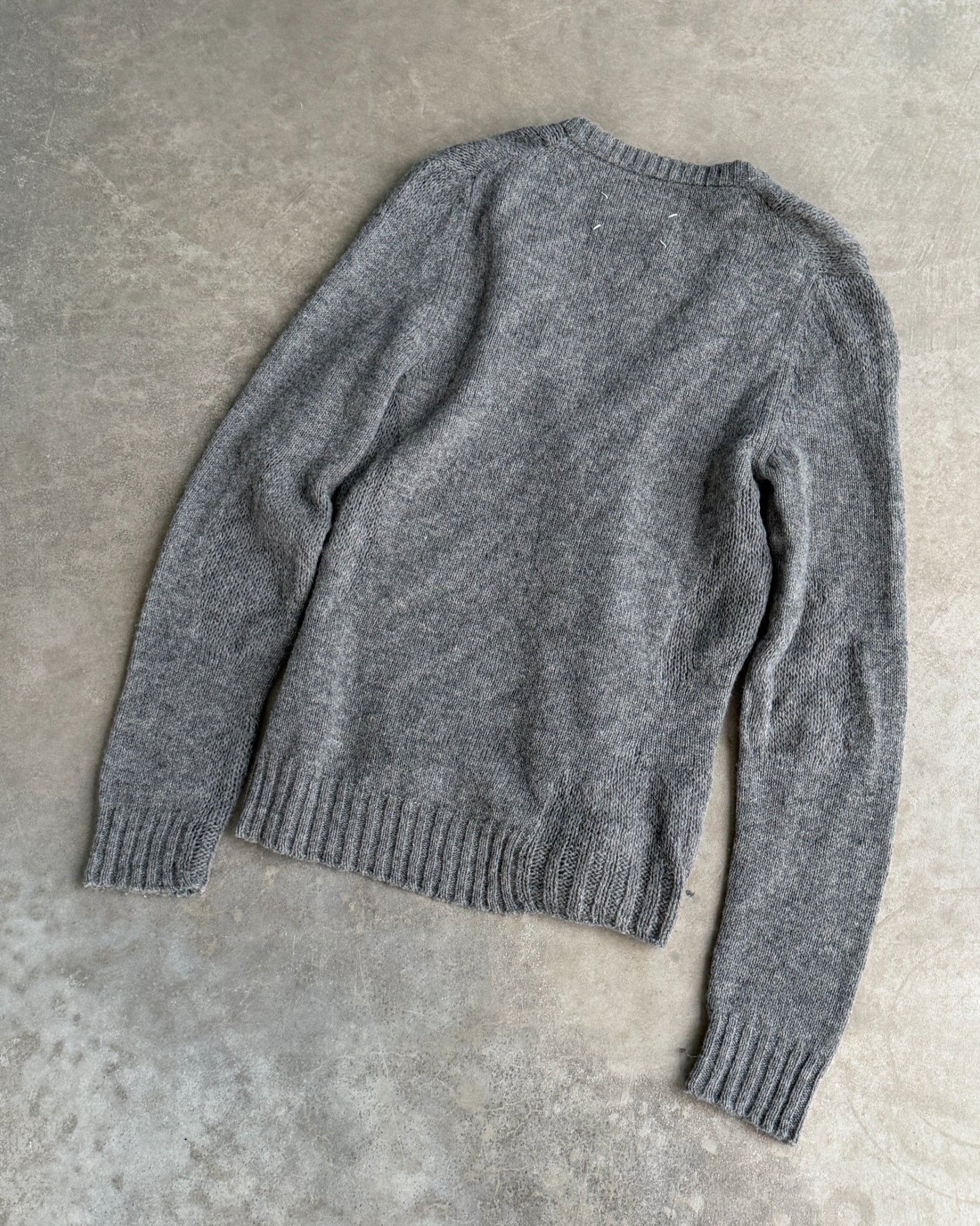 Maison Margiela 10 Wool Cardigan – S-on a concrete background