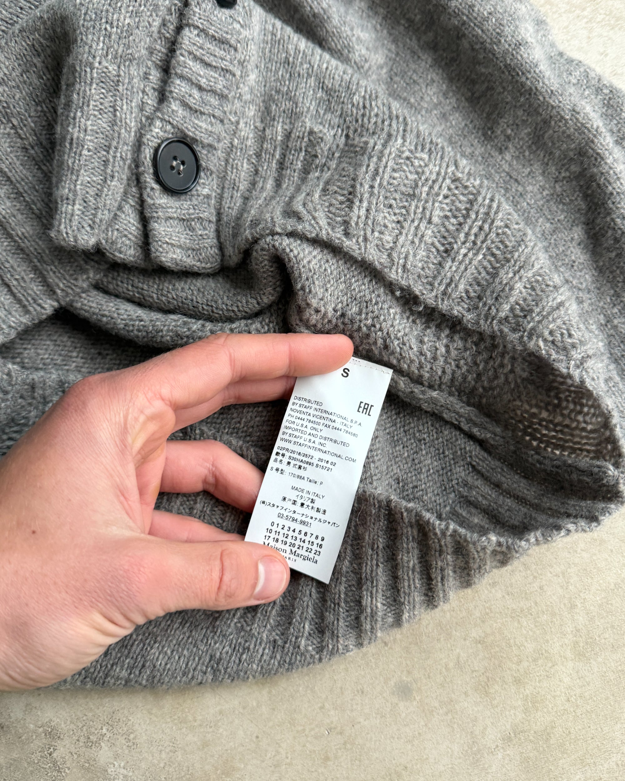 Maison Margiela 10 Wool Cardigan – S-on a concrete background