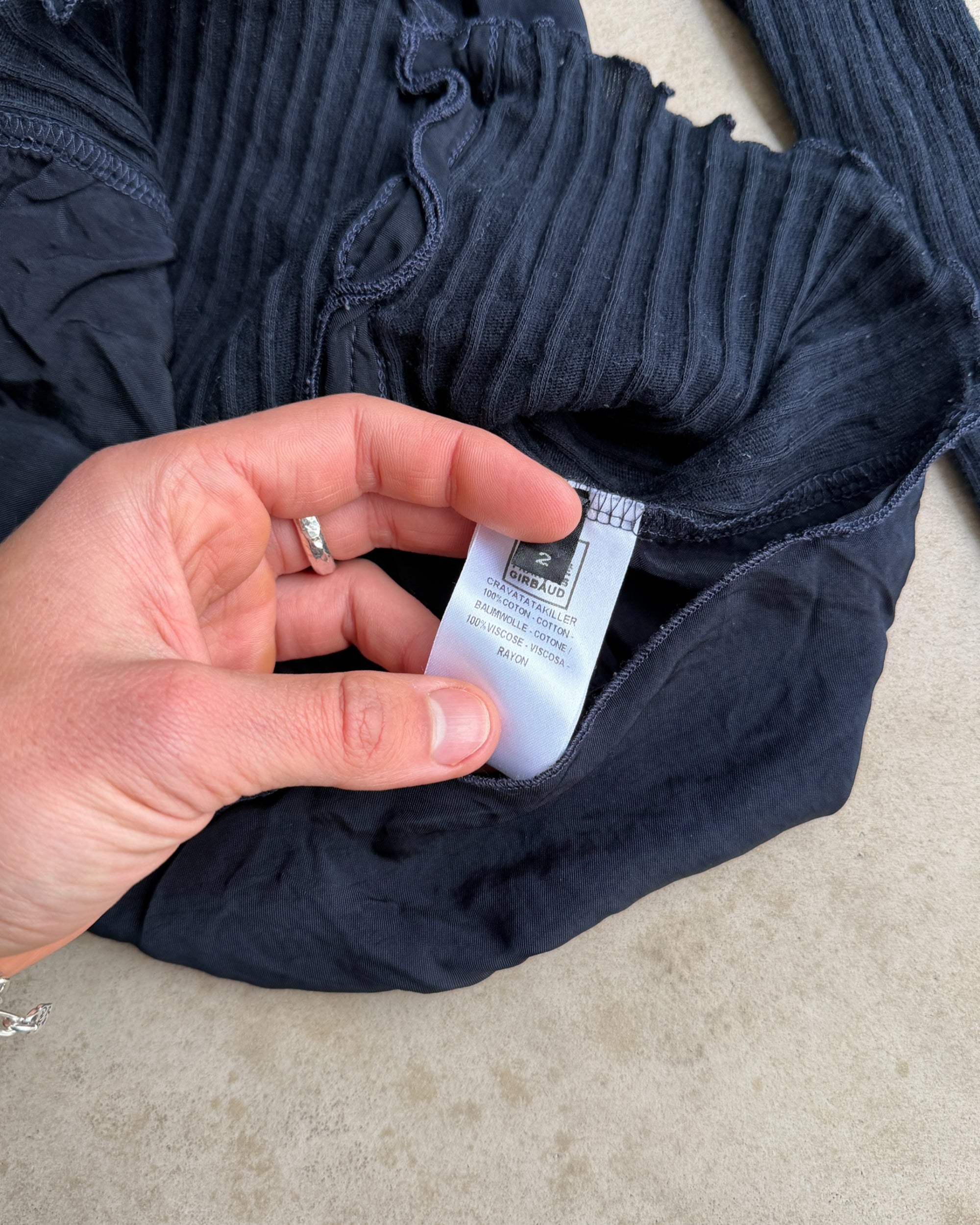 Marithé + François Girbaud MFG Button-Up Top – S-on a concrete background