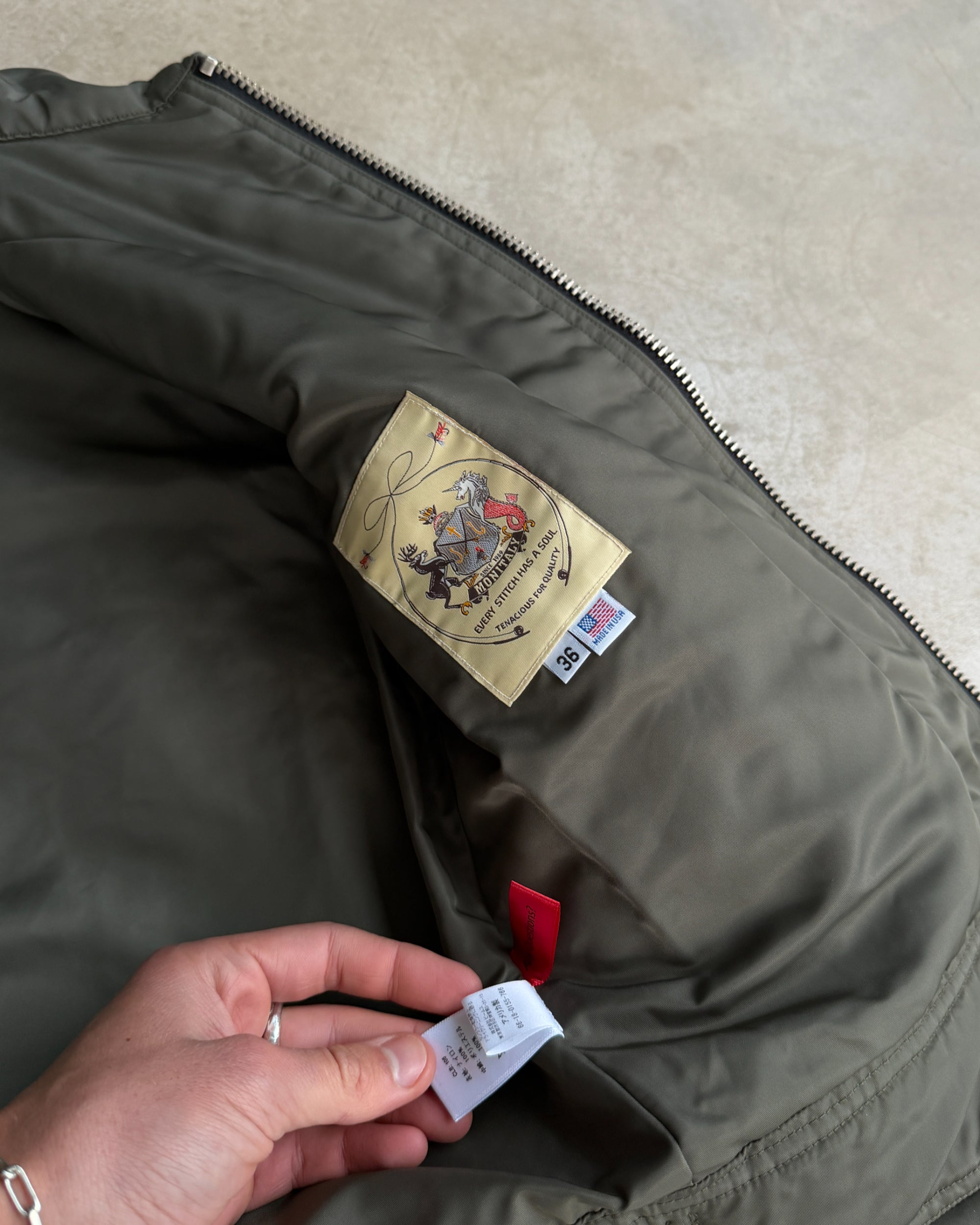 Monitaly Fireman Clasp Padded Jacket – M-on a concrete background