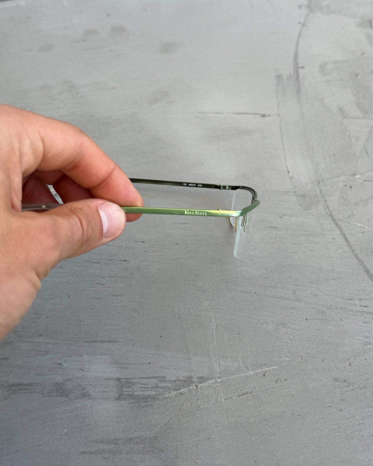 Max Mara Clear Lens Rimless Glasses-on a concrete background