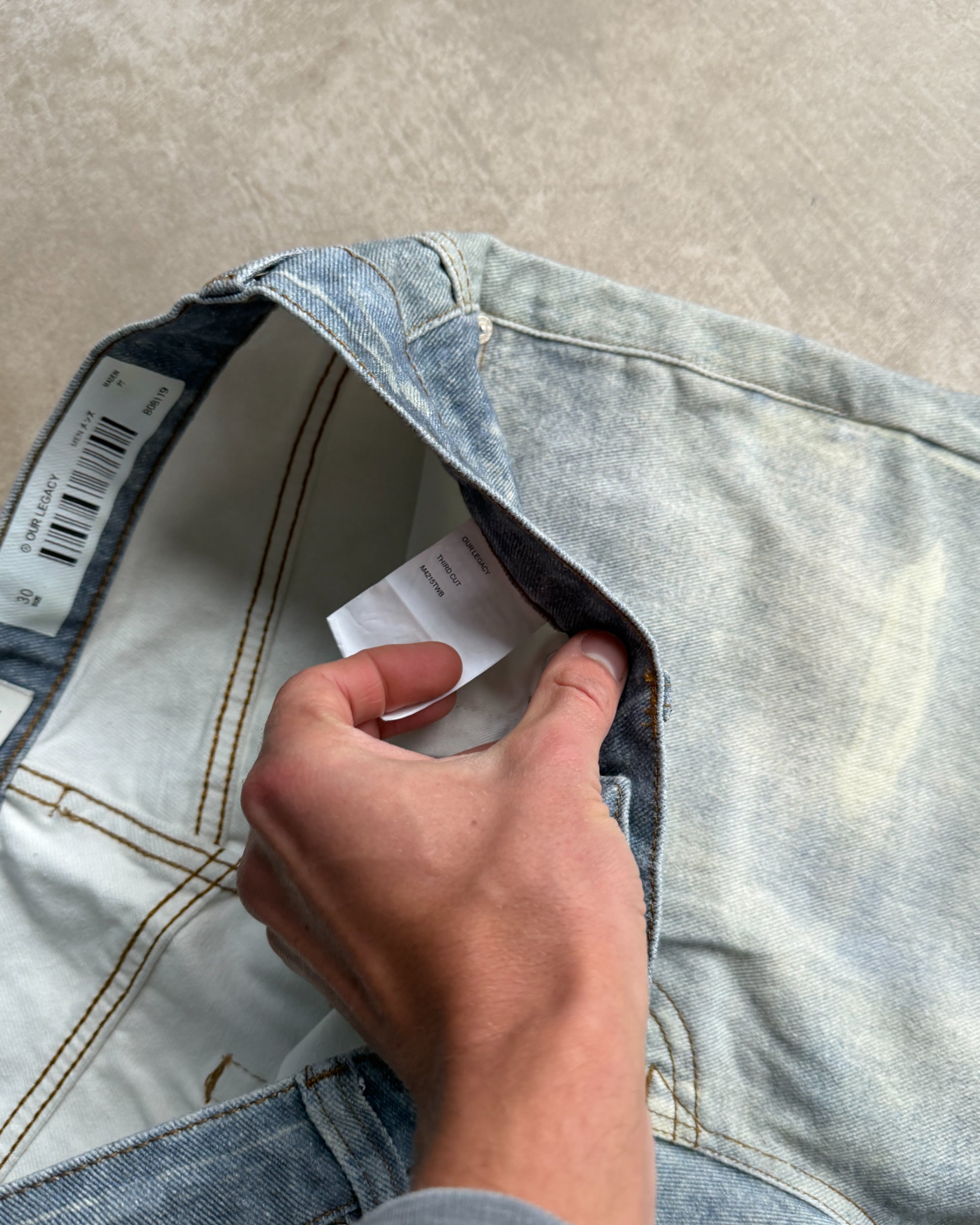 Our Legacy Third Cut Digital Print Distressed Denim Jeans – W30–32-on a concrete background