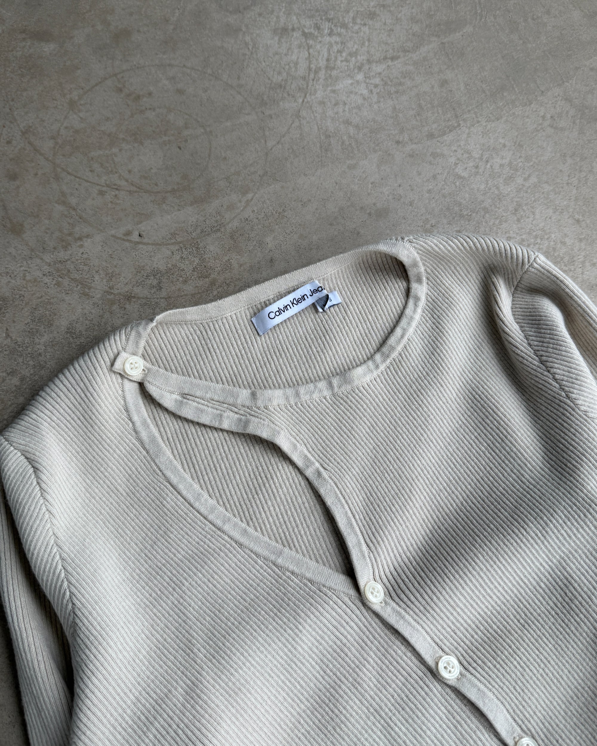 Calvin Klein Jeans Asymmetric Ribbed Cardigan – S-on a concrete background