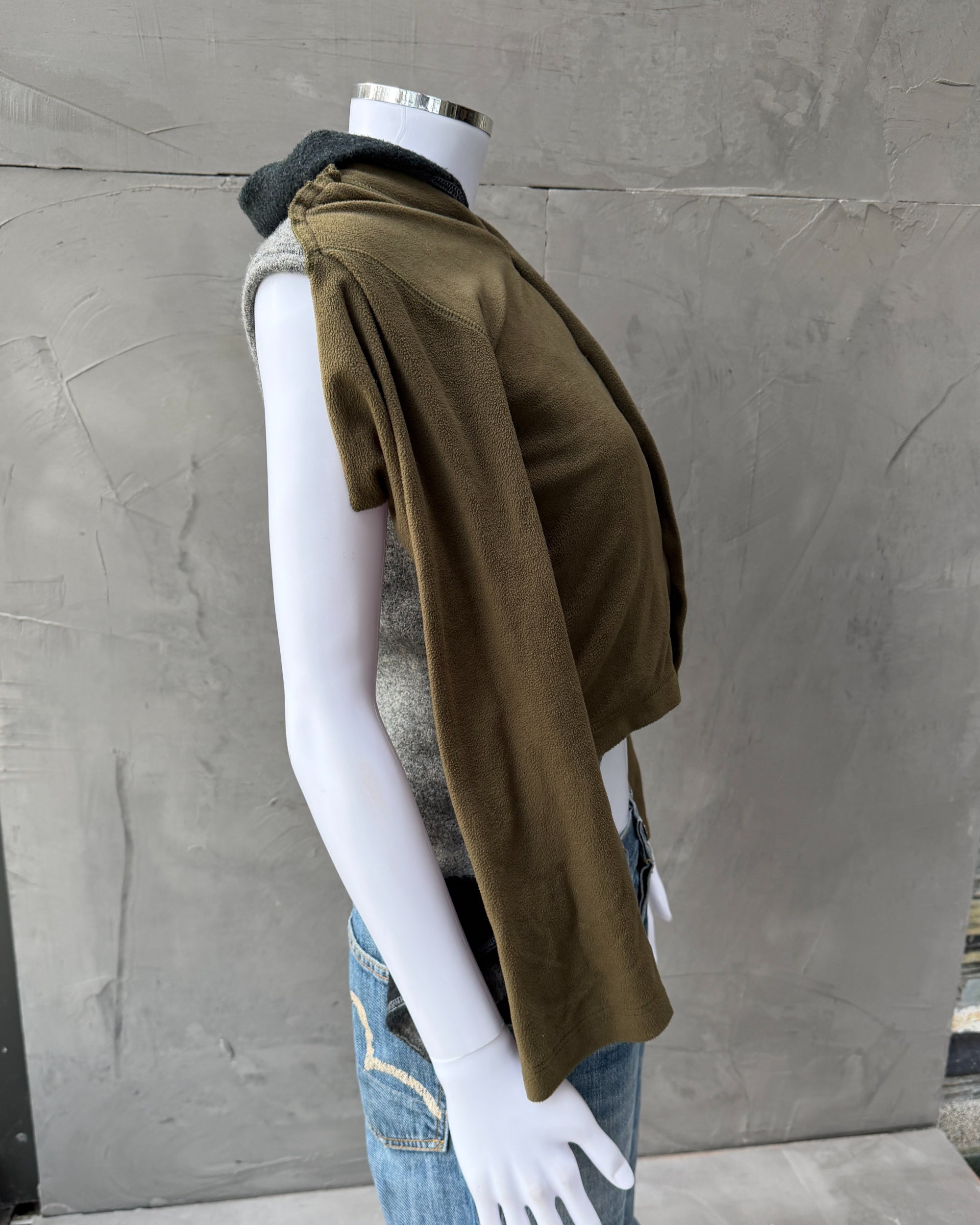 Comme des Garçons 2009 Layered Armhole Cardigan – XS–S-on a concrete background