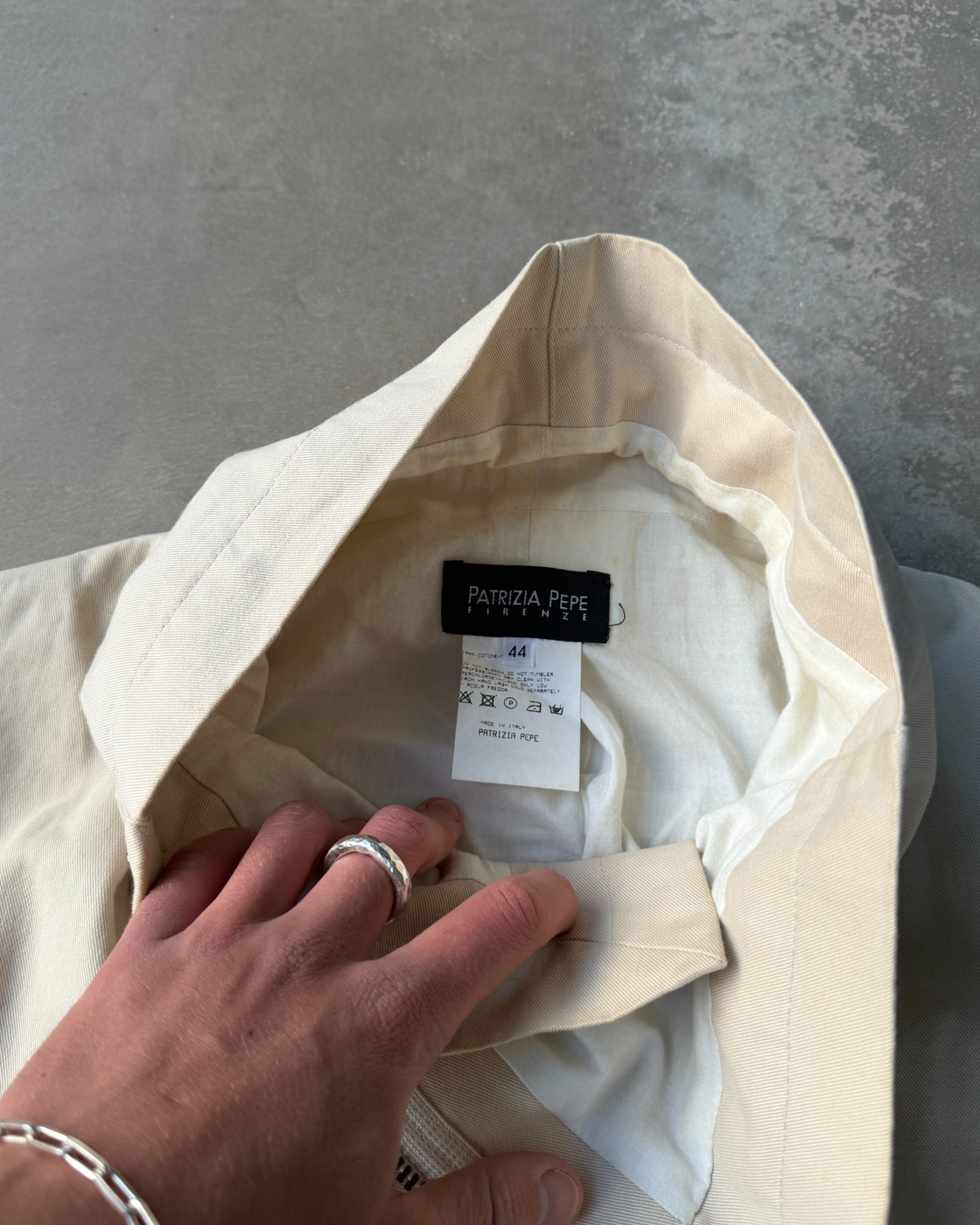Patrizia Pepe Asymmetric Cotton Jacket – M-on a concrete background