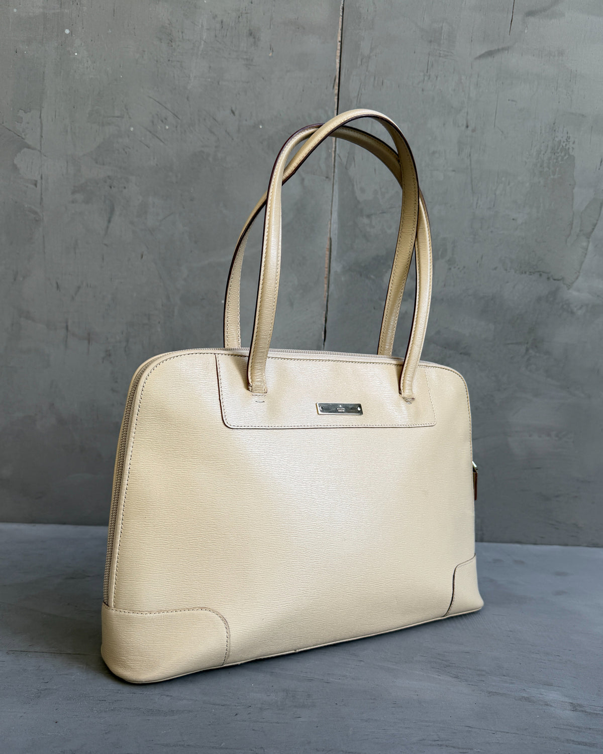 Gucci Beige Structured Leather Handbag-on a concrete background