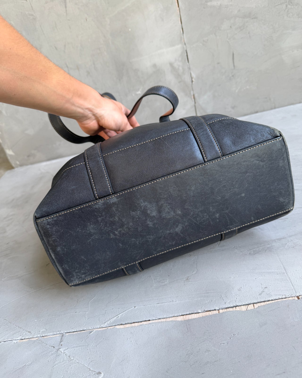 Coach Black Leather Tote Shoulder Bag-on a concrete background