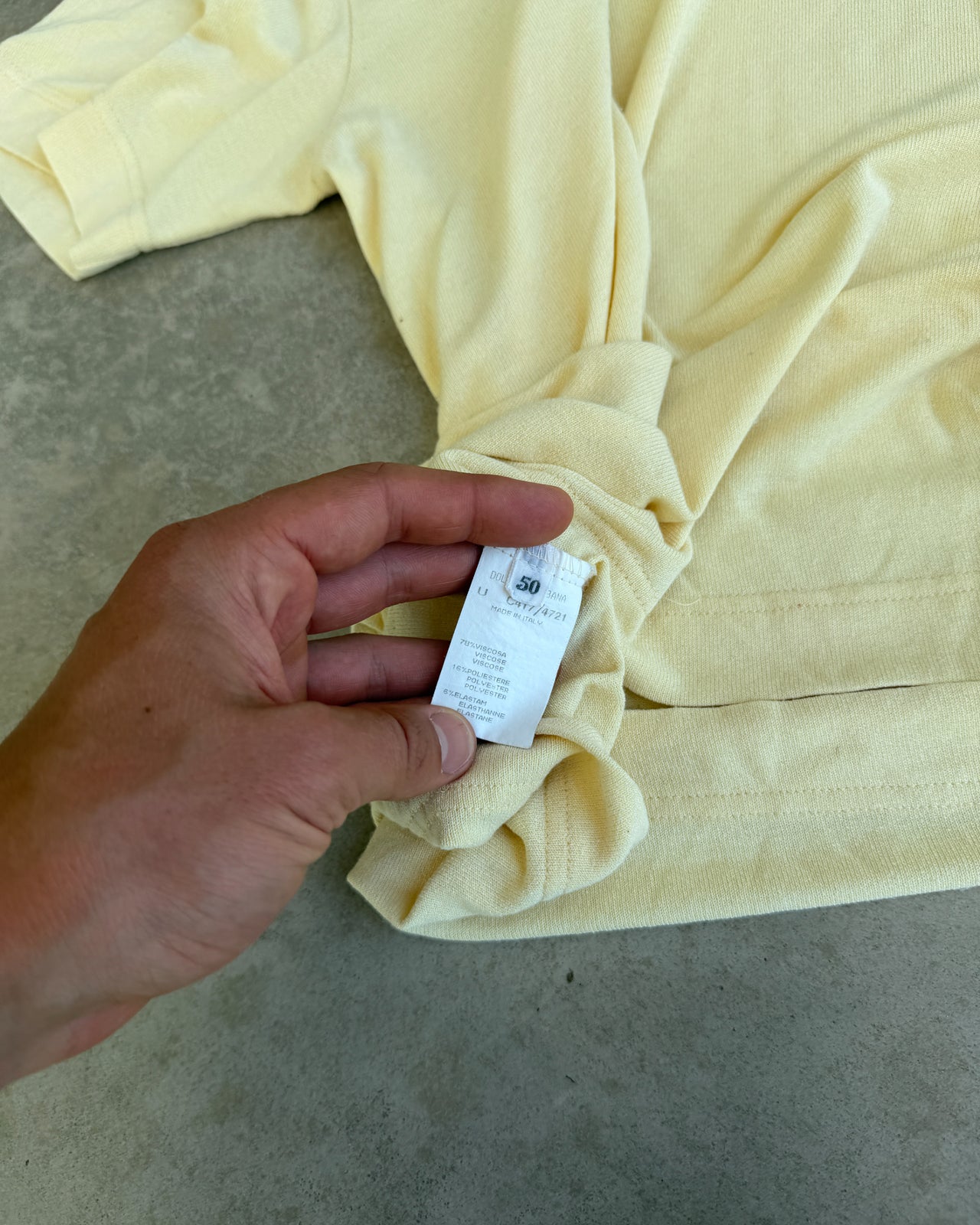 Dolce & Gabbana Yellow Viscose Semi Sheer V Neck T-Shirt – L-on a concrete background