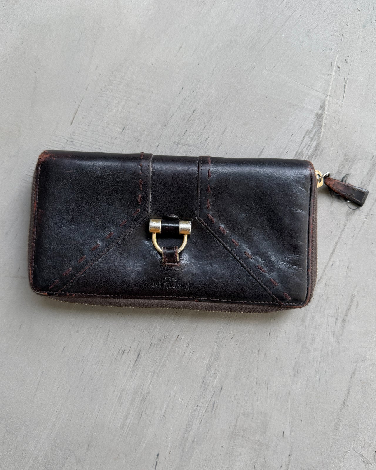 Yves Saint Laurent Leather Wallet-on a concrete background