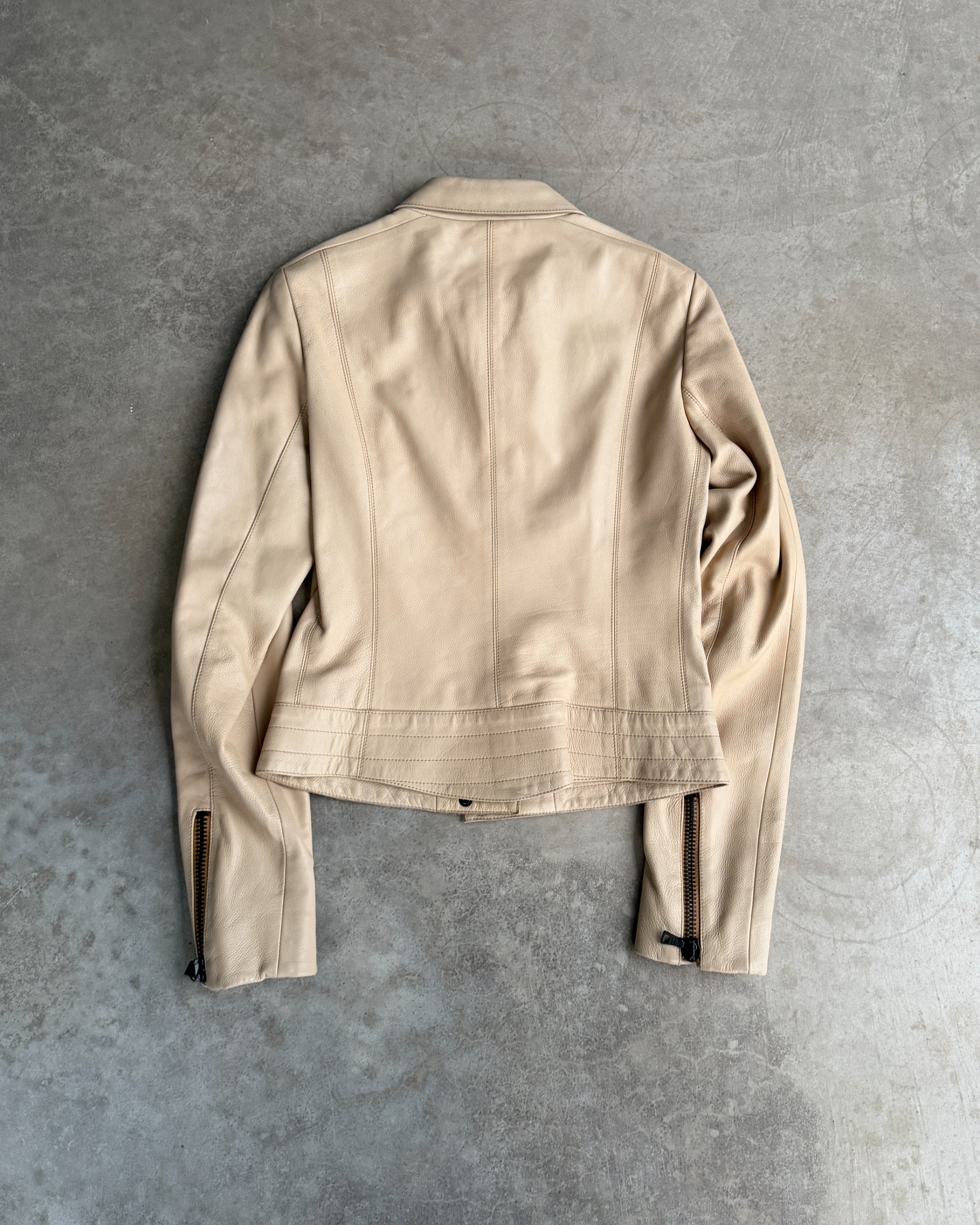 Prada Beige Leather Belted Jacket – M-on a concrete background