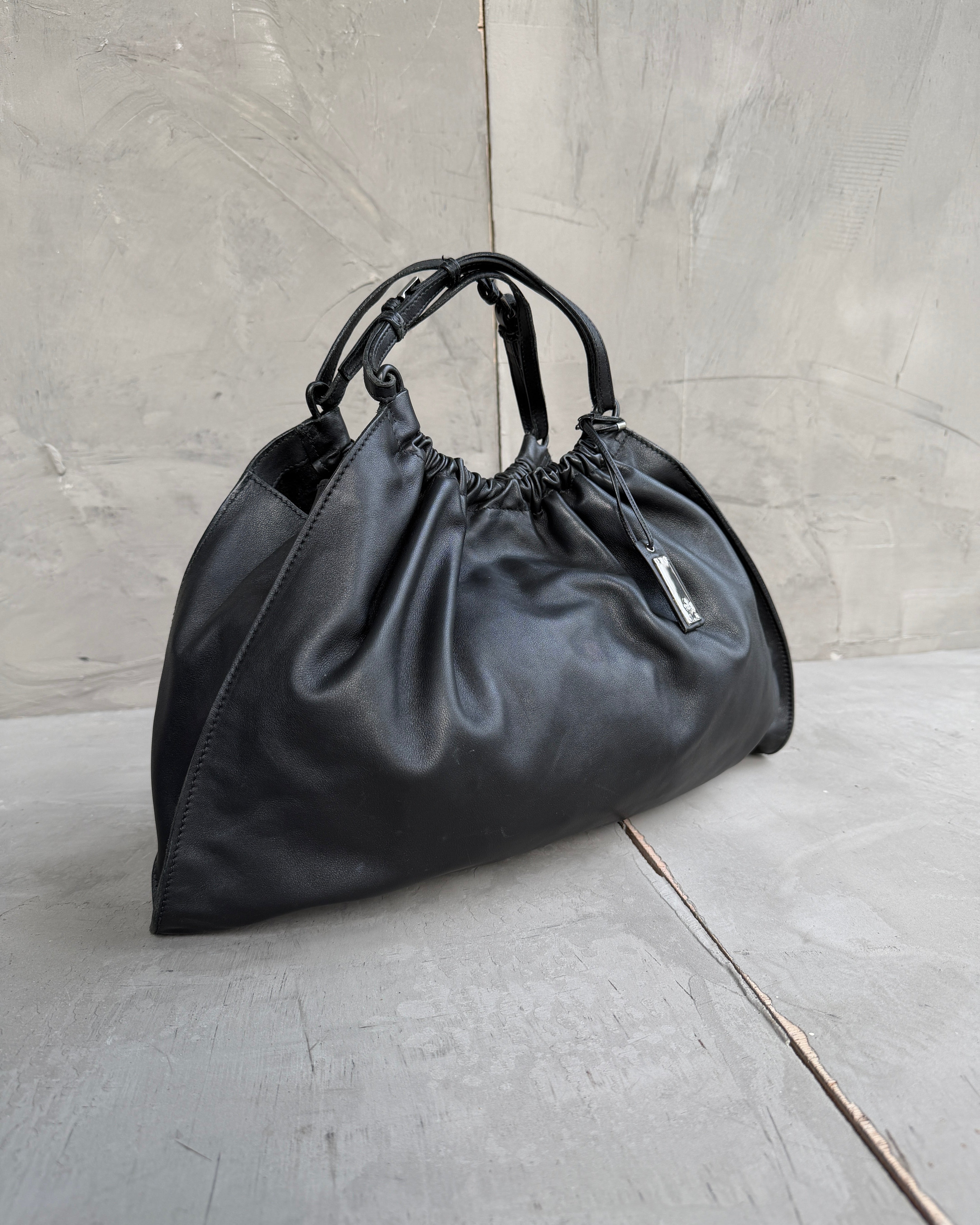 Gucci by Tom Ford Ruched Leather Shoulder Bag-on a concrete background