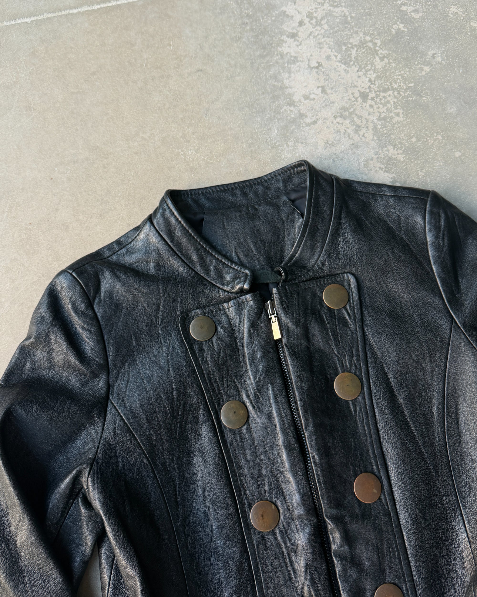 1990s Korean Studded Leather Jacket – S–M-on a concrete background