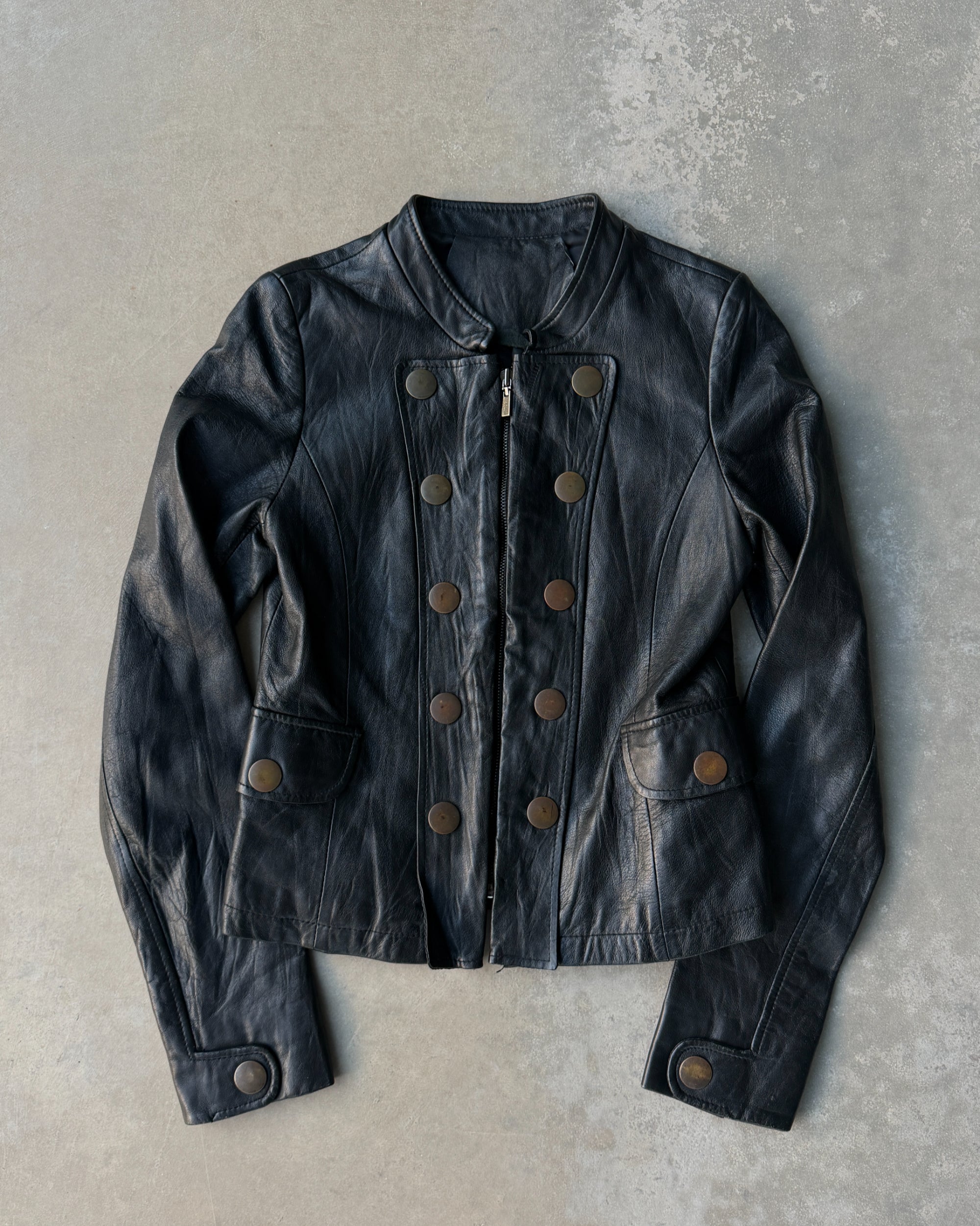 1990s Korean Studded Leather Jacket – S–M-on a concrete background