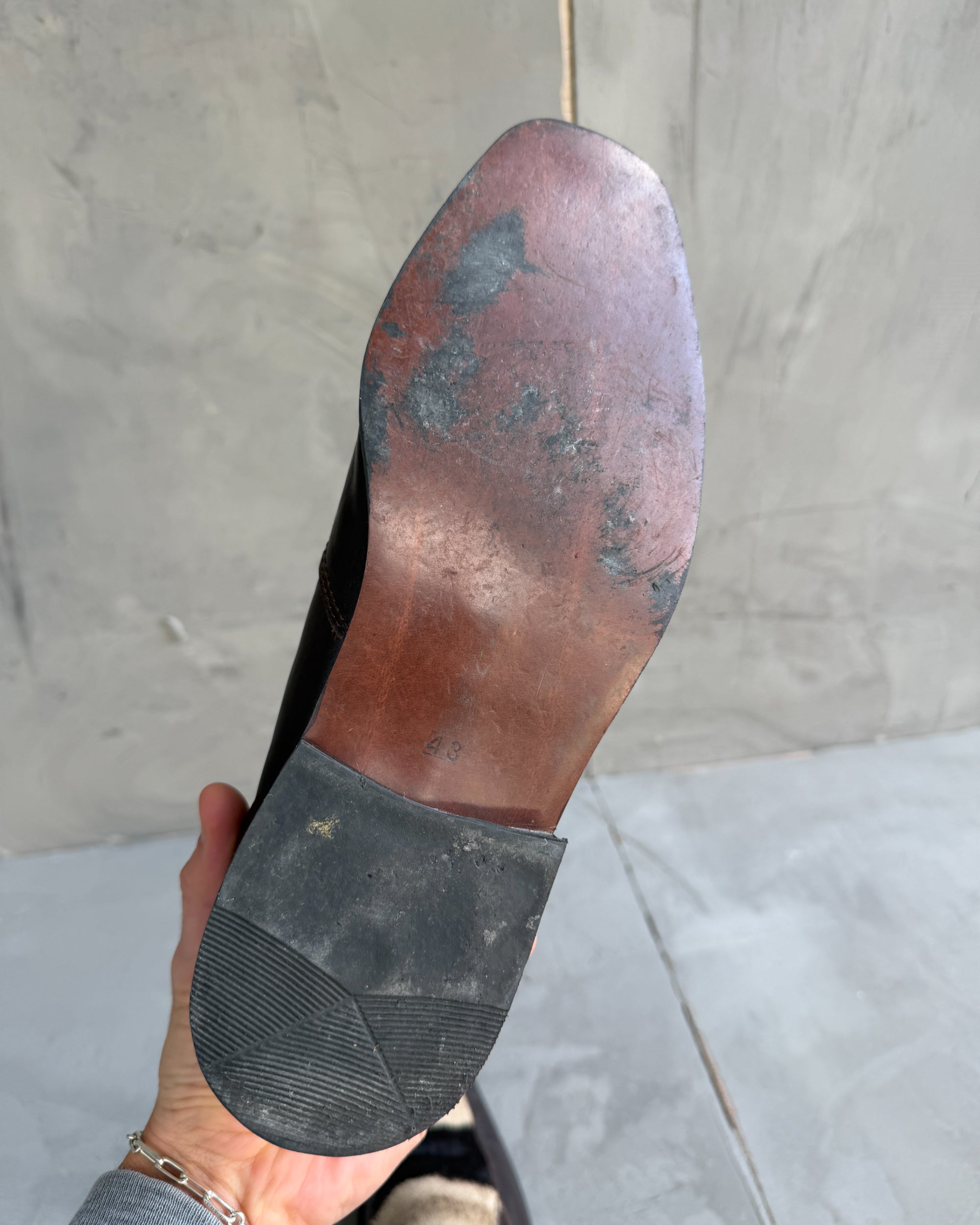 Manock Zebra Skin Loafers – EU 43-on a concrete background