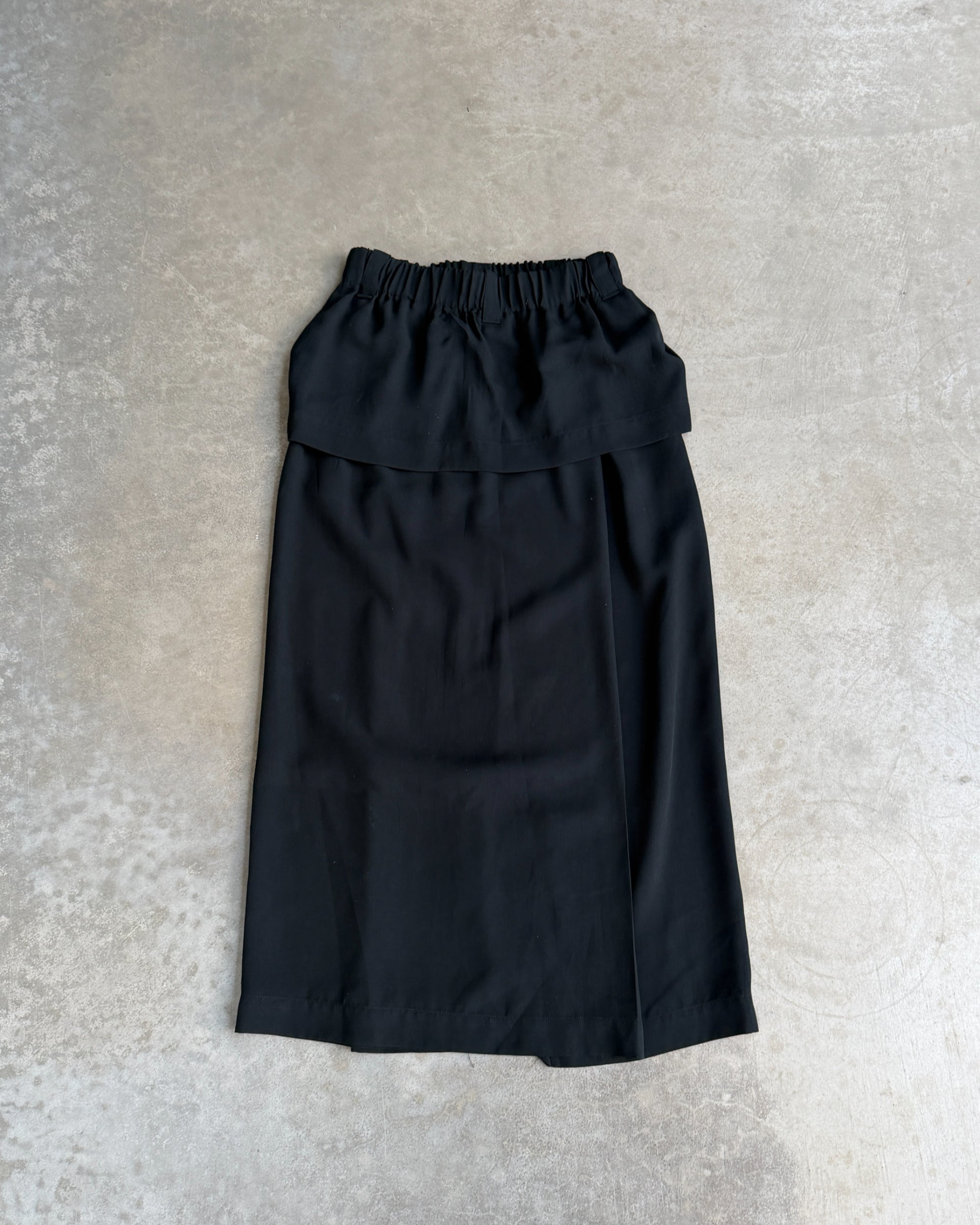Issey Miyake Permanente Maxi Skirt – S-on a concrete background