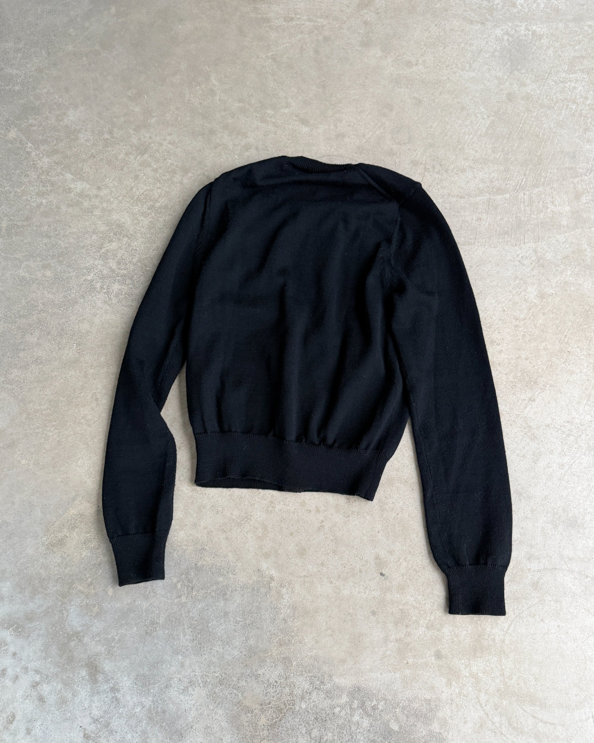 Comme des Garçons 2015 Wool Cardigan – XS-on a concrete background