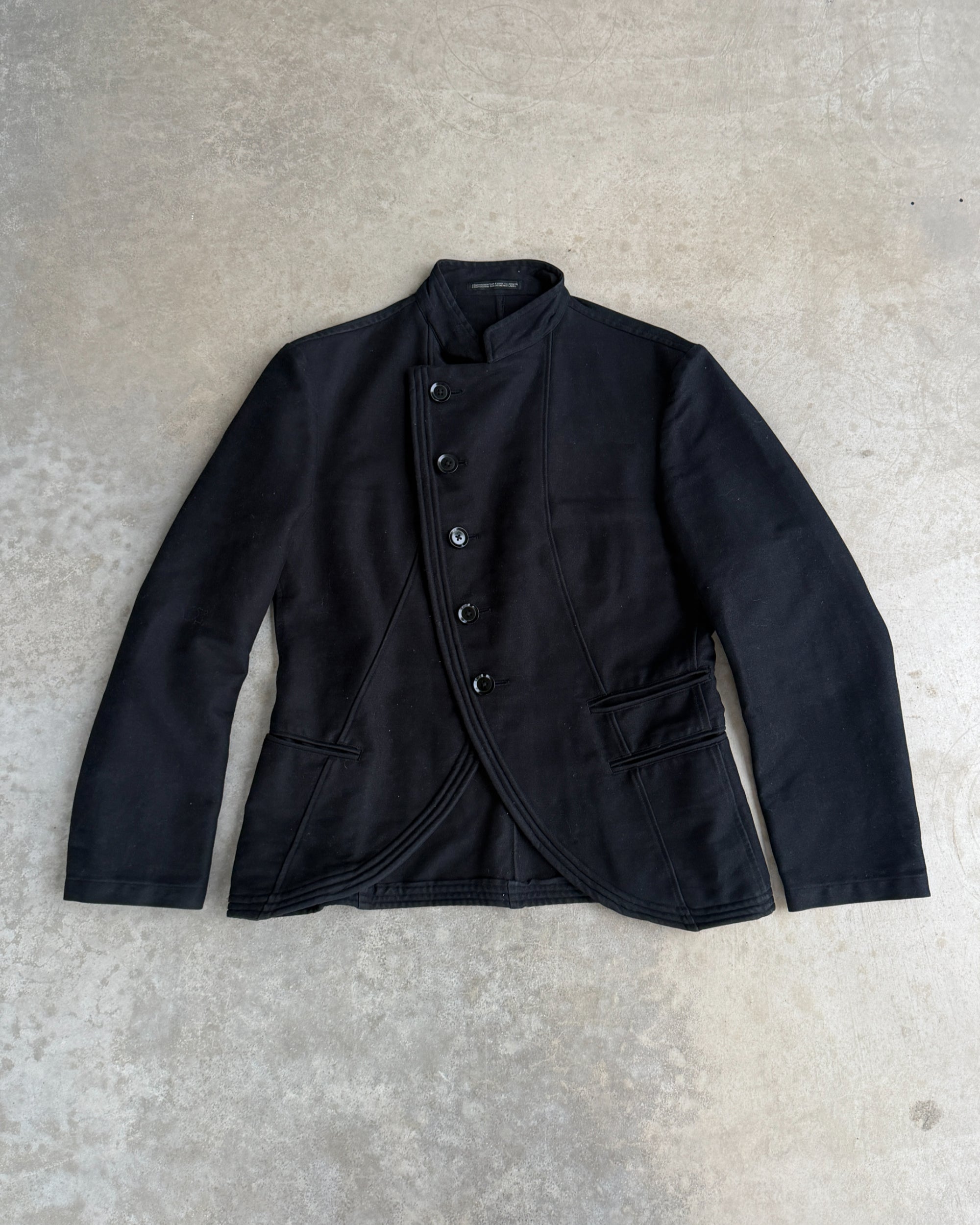 Yohji Yamamoto AW06 Asymmetric Cotton Jacket – S-on a concrete background