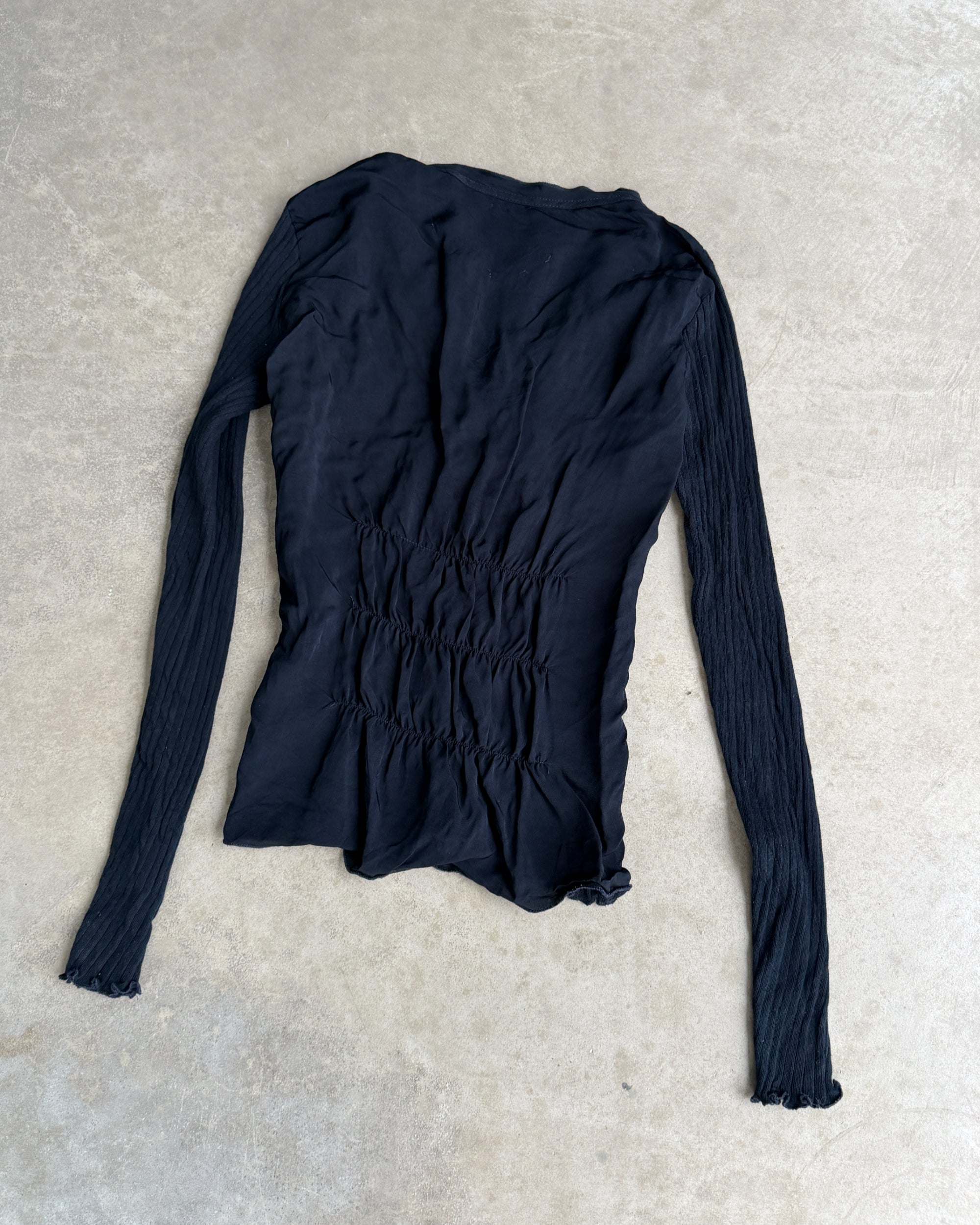 Marithé + François Girbaud MFG Button-Up Top – S-on a concrete background
