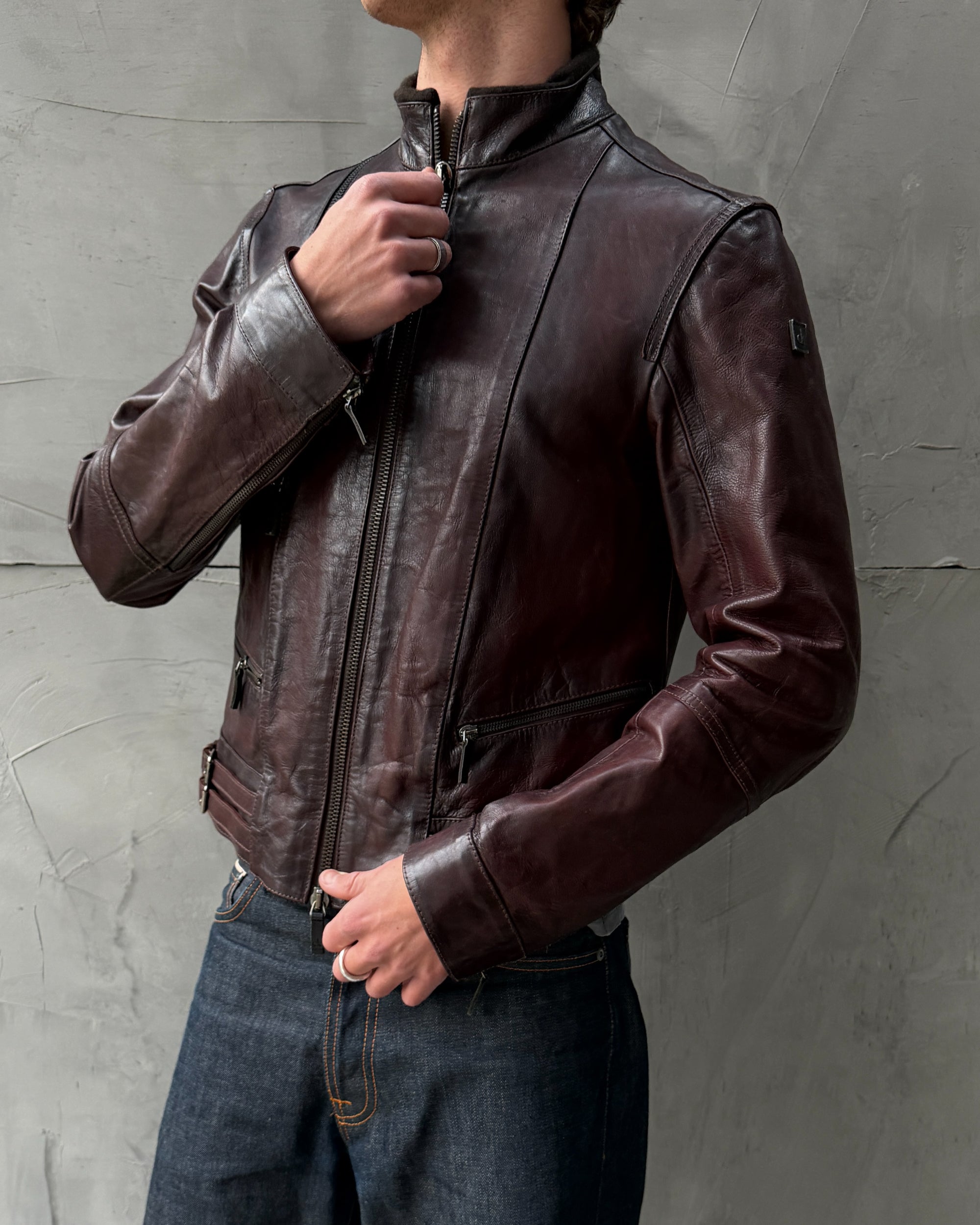 Calvin Klein Buckle Leather Jacket – M-on a concrete background