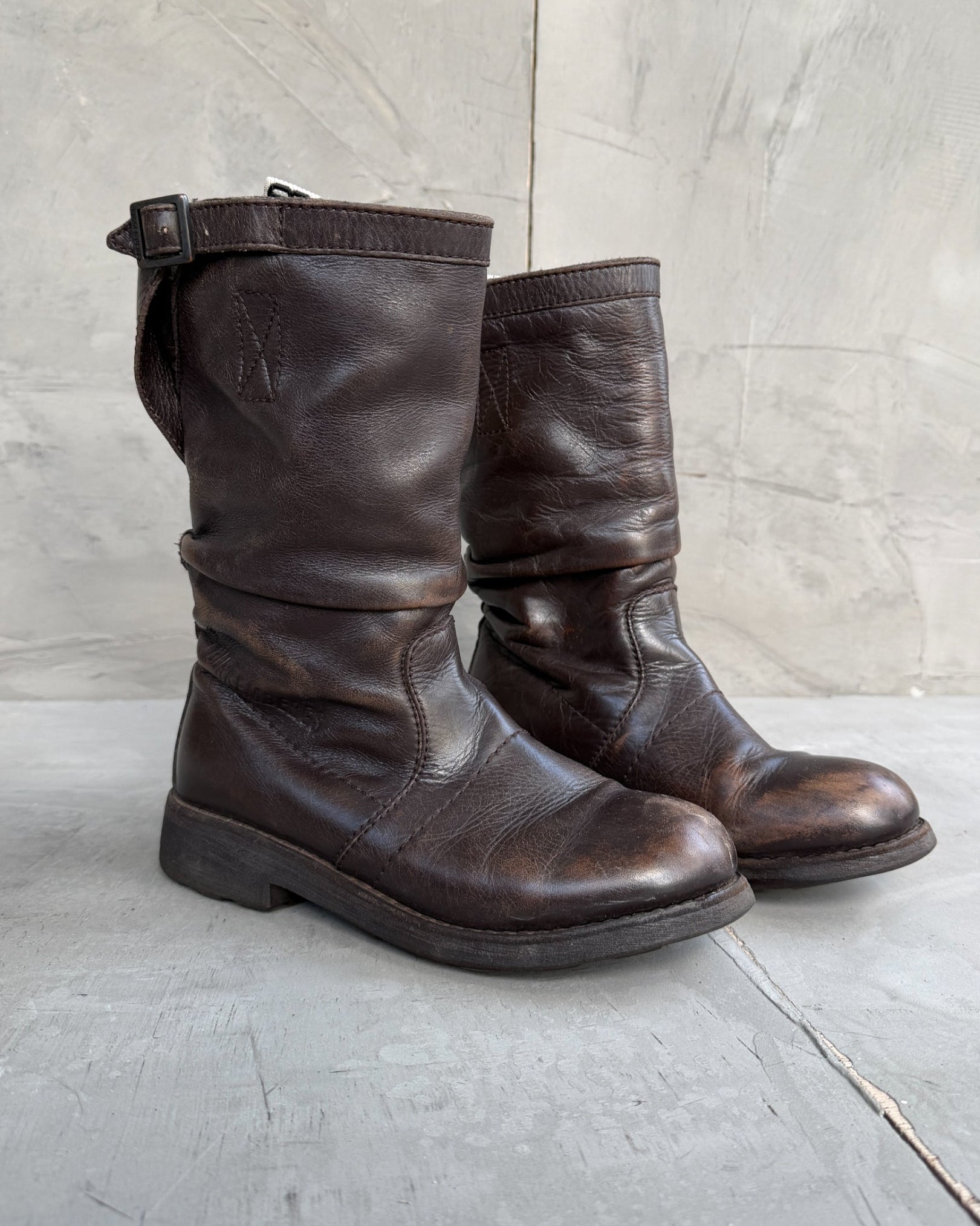 Bikkembergs Slushy Leather Boots with Buckle – EU 36-on a concrete background