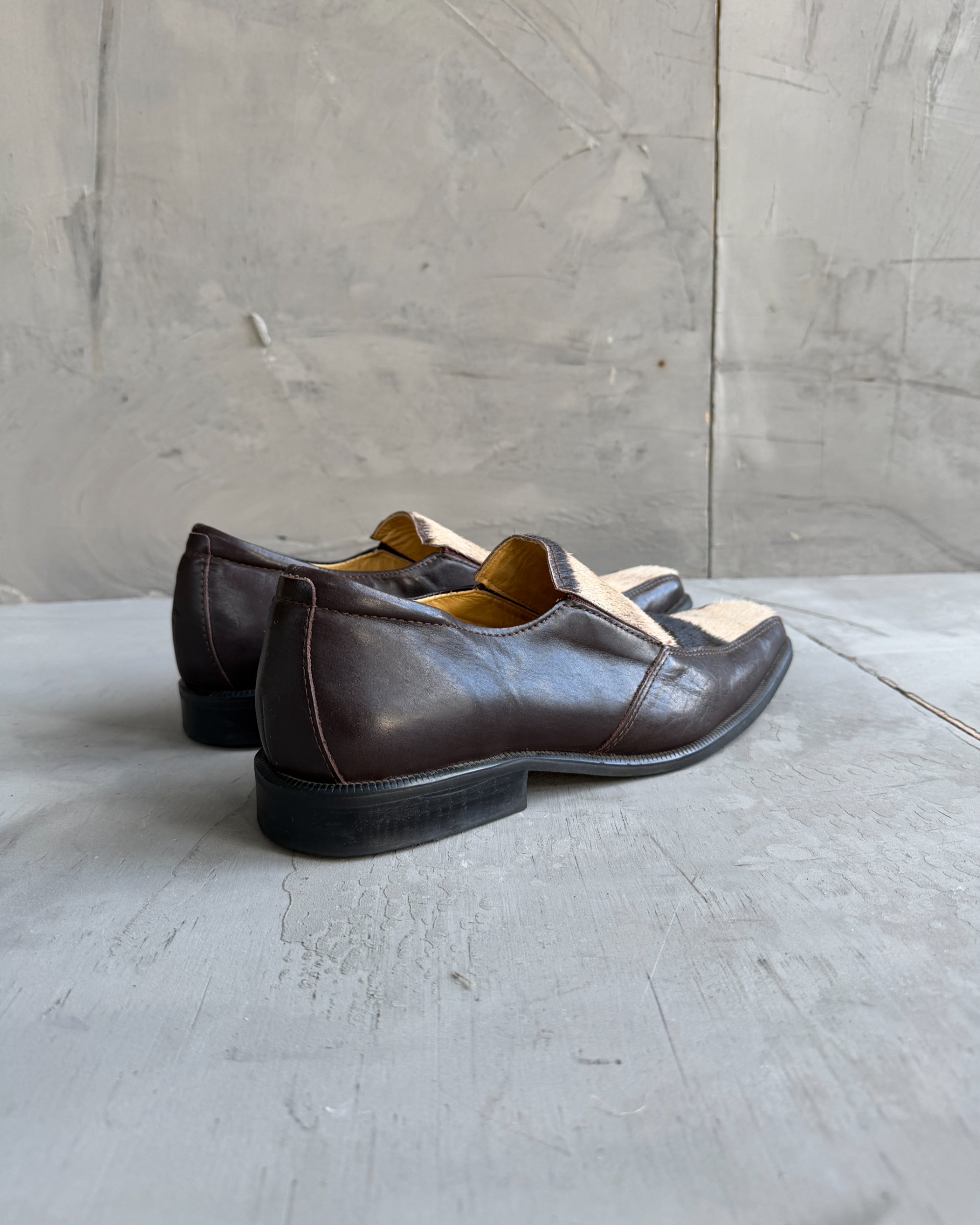Manock Zebra Skin Loafers – EU 43-on a concrete background