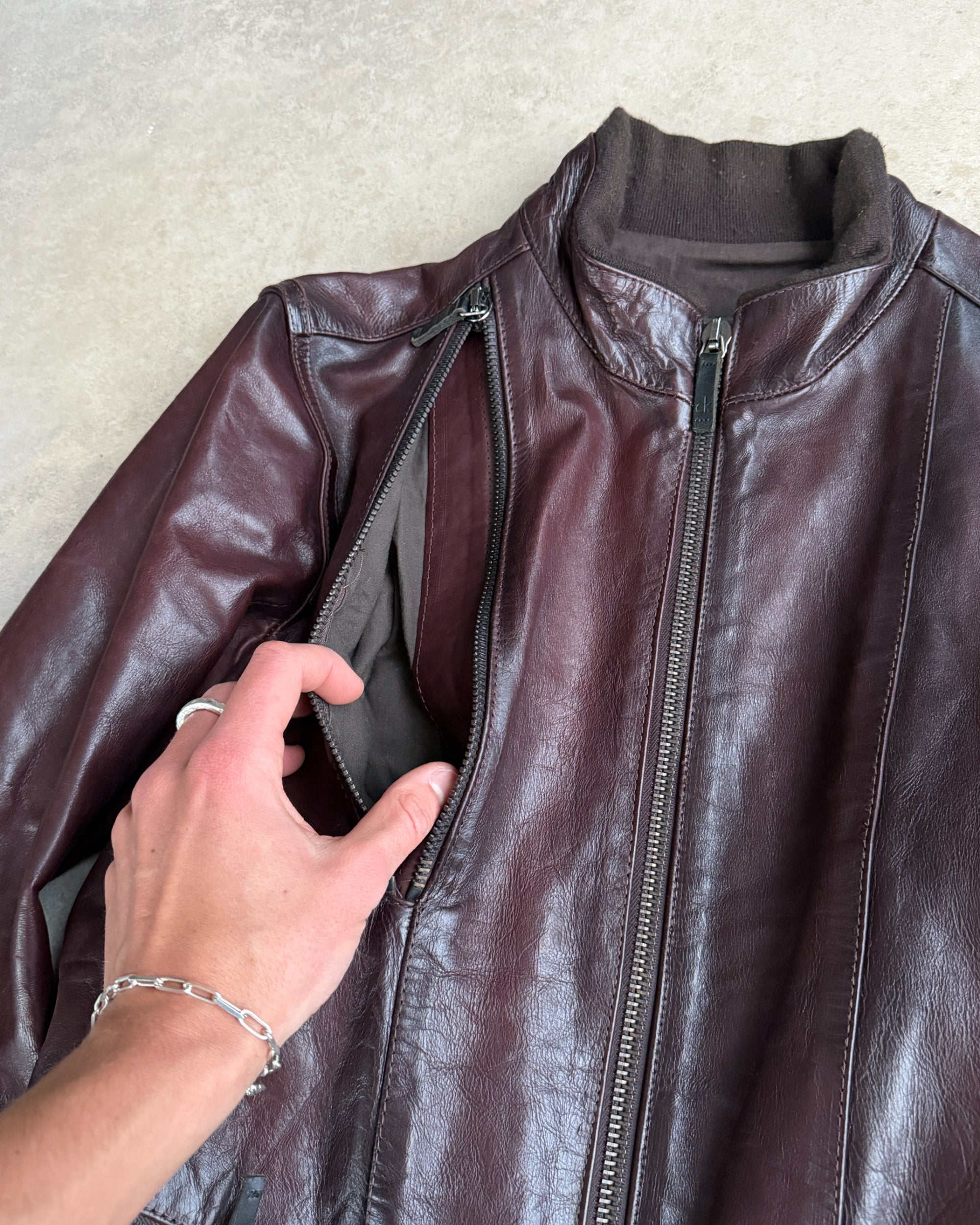 Calvin Klein Buckle Leather Jacket – M-on a concrete background