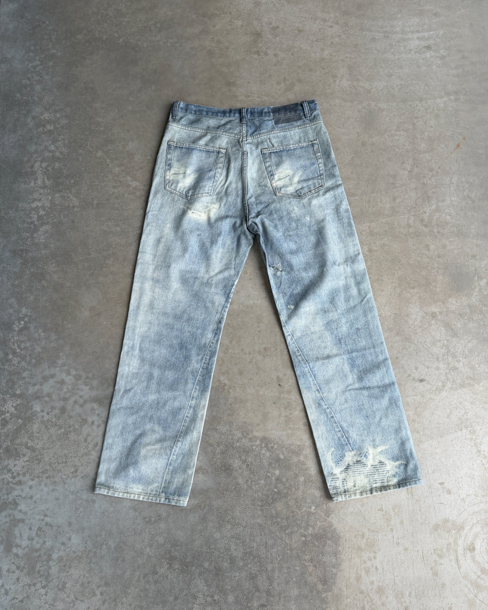 Our Legacy Third Cut Digital Print Distressed Denim Jeans – W30–32-on a concrete background