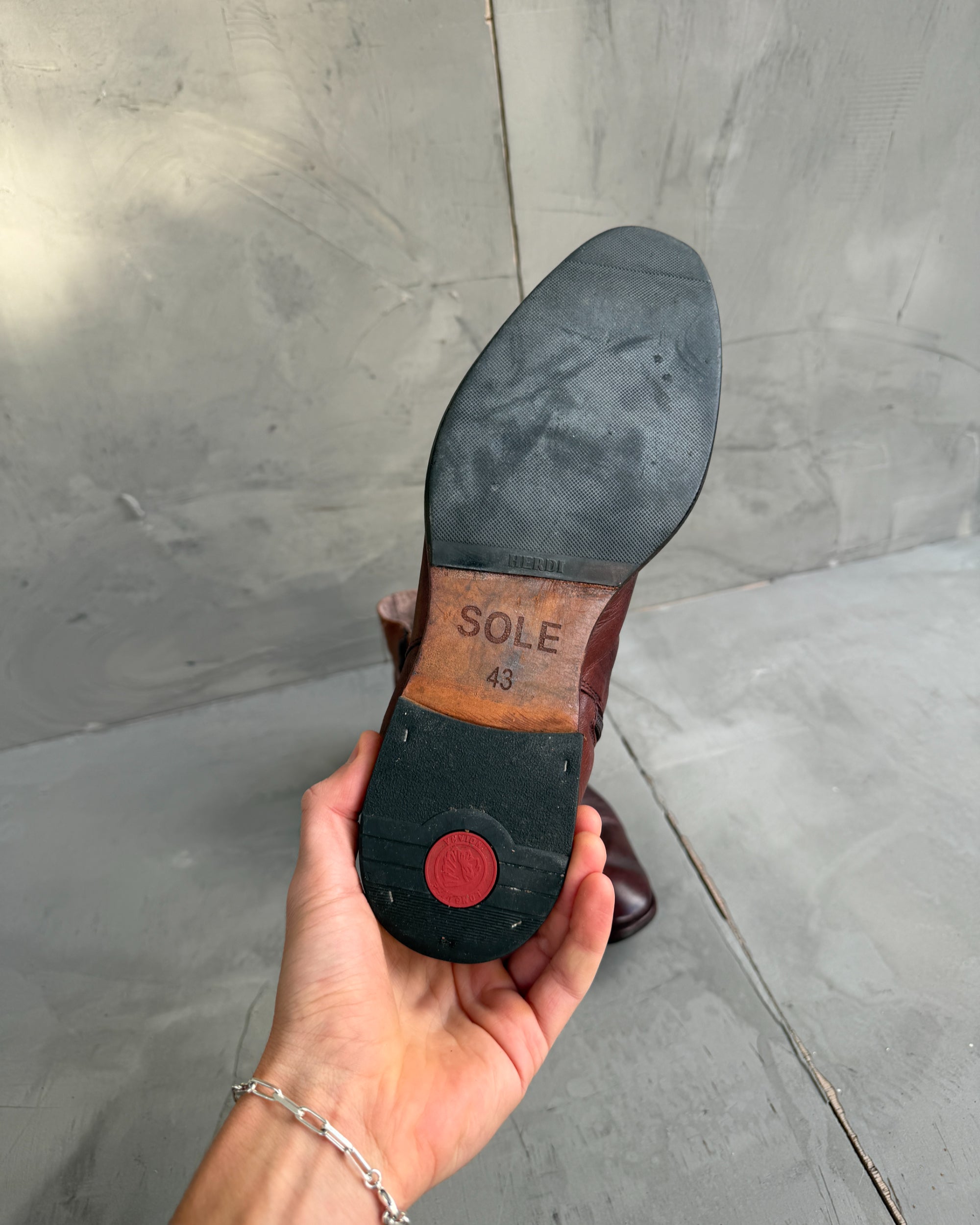 Sole Made in London Creased Leather Ankle Boots – EU 43-on a concrete background