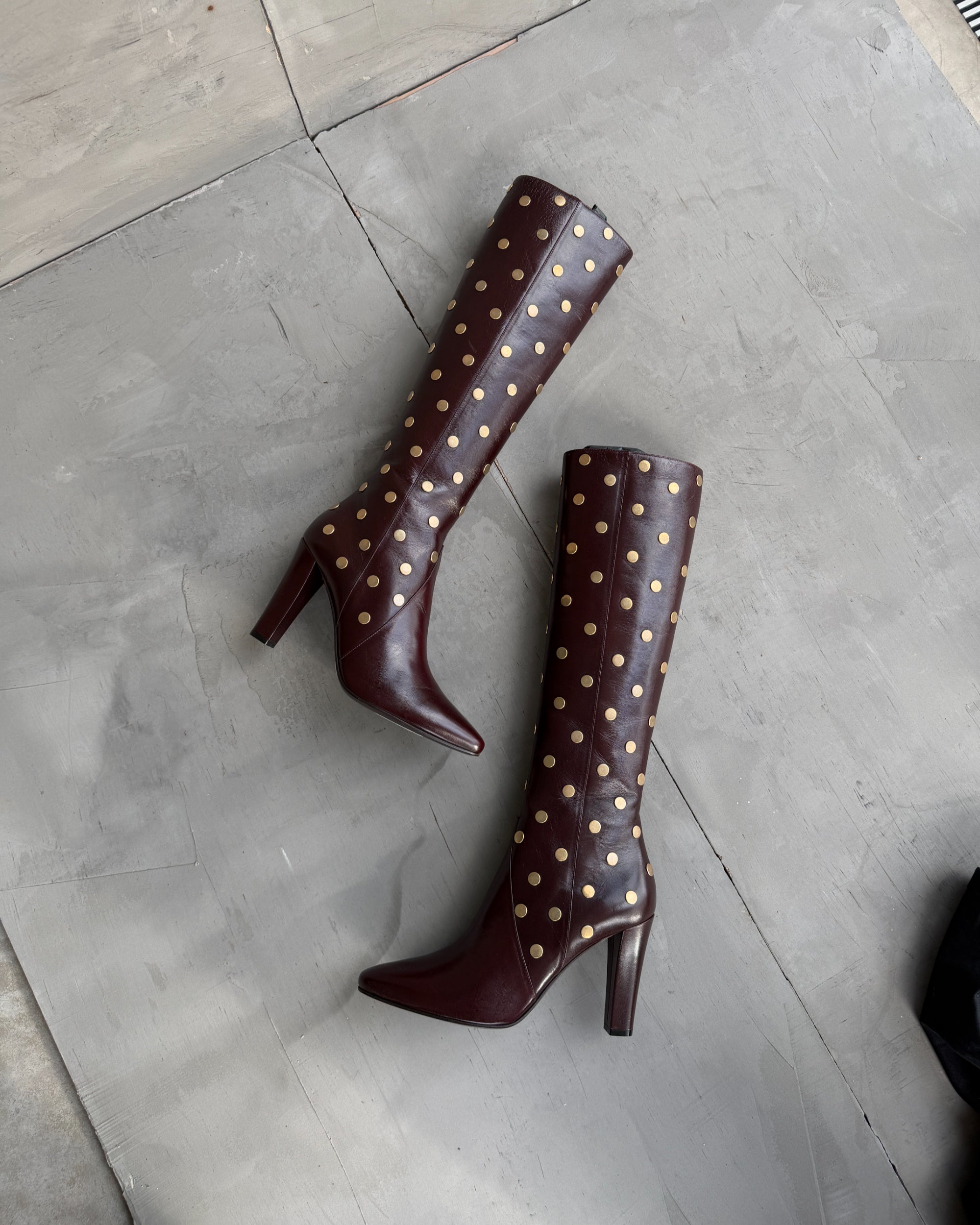 Saint Laurent Studded Leather Heeled Boots – EU 40-on a concrete background