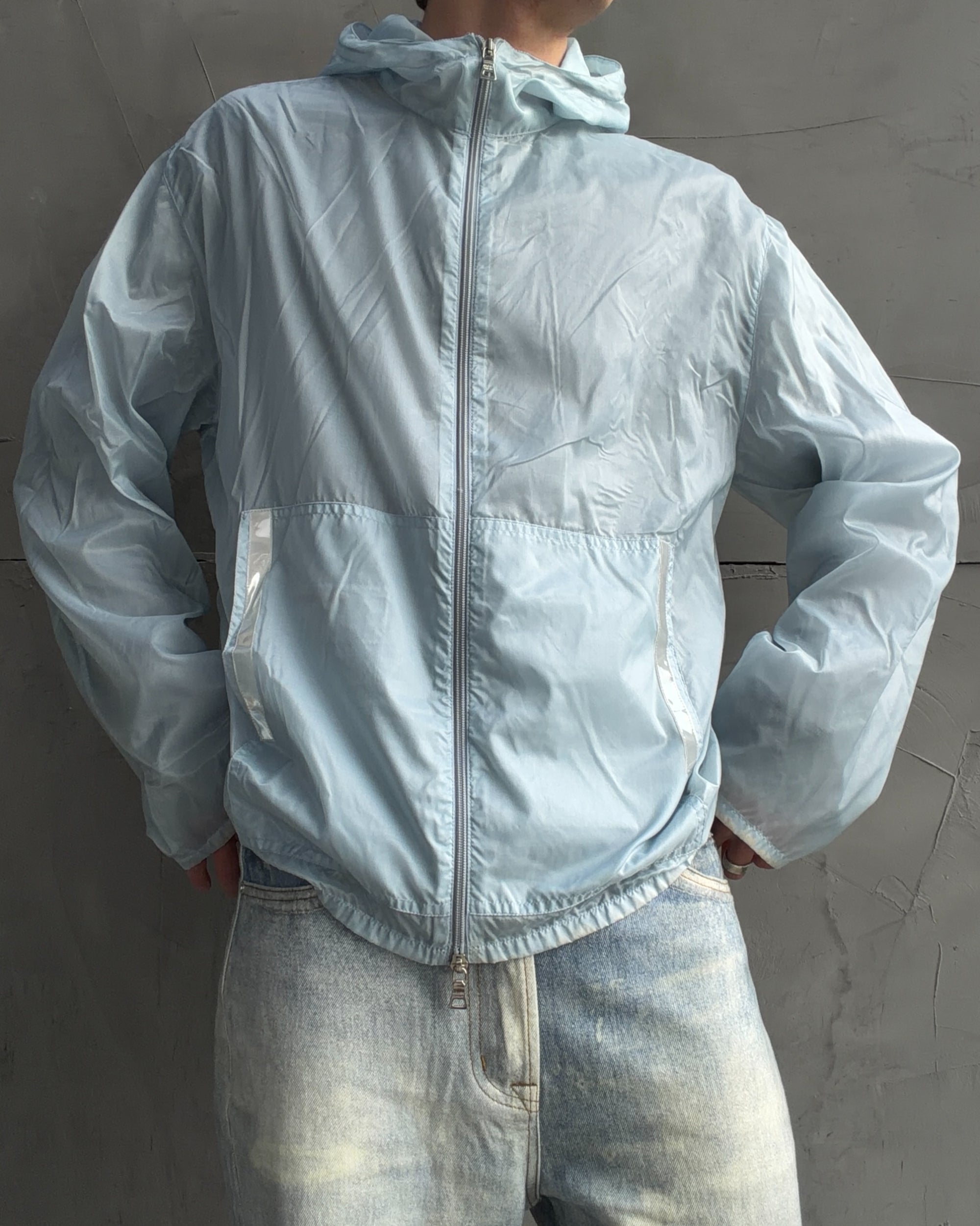 Prada SS99 Transparent Nylon Jacket – XL-on a concrete background
