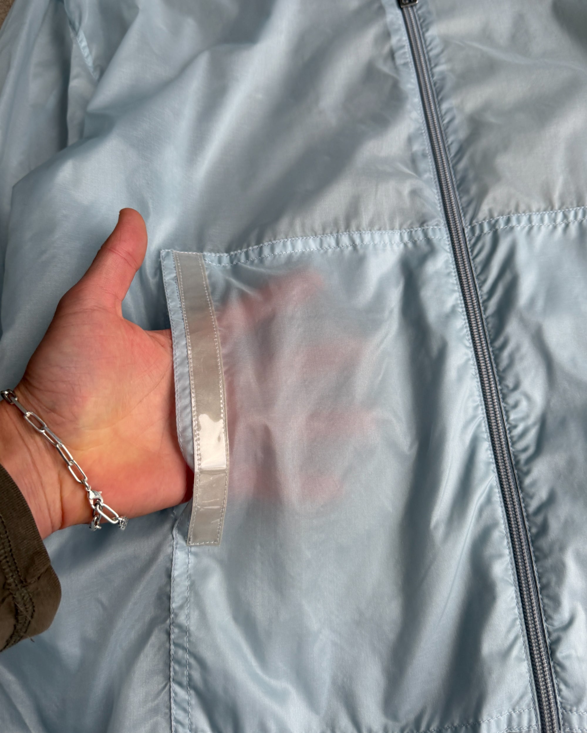 Prada SS99 Transparent Nylon Jacket – XL-on a concrete background