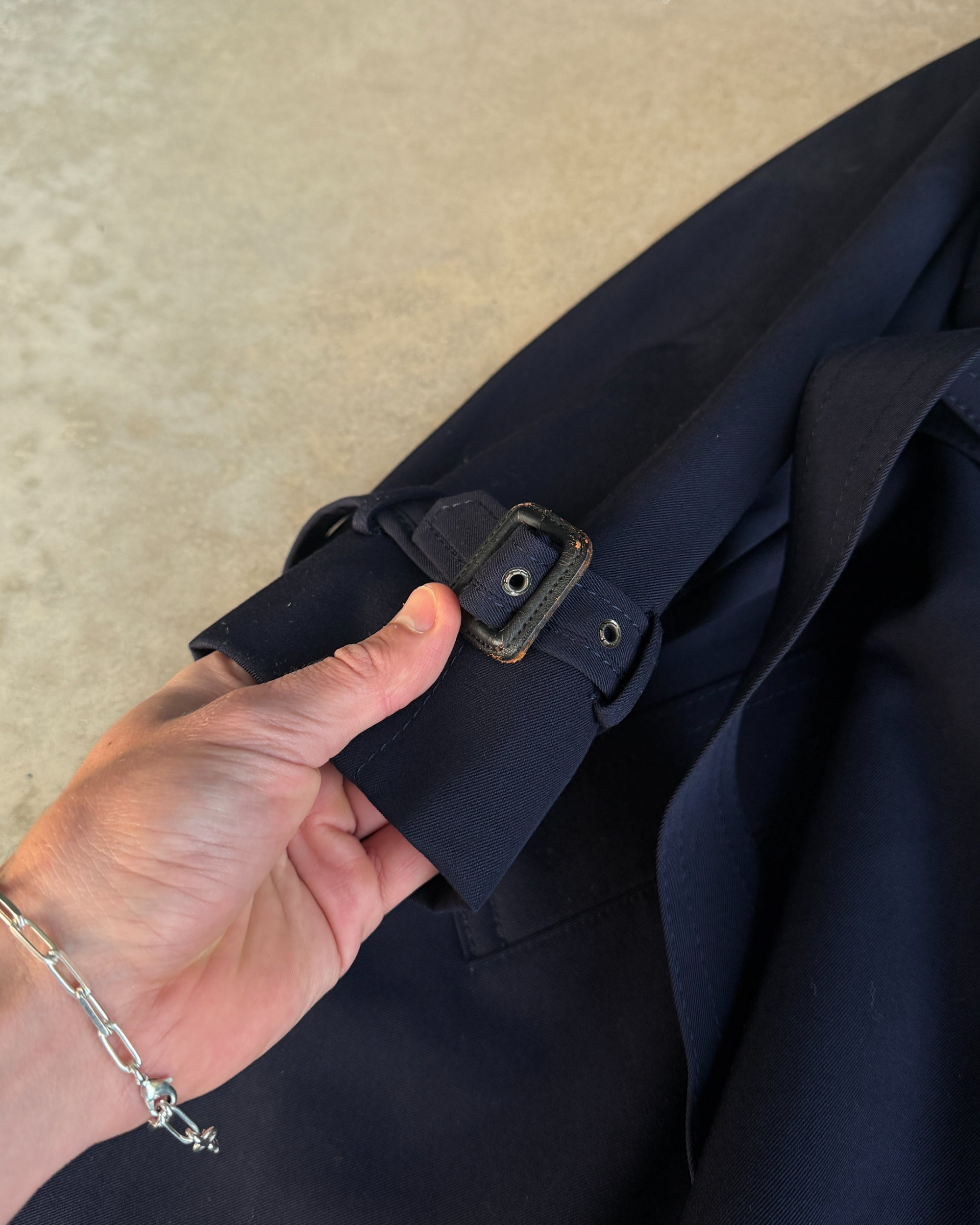 Yves Saint Laurent Wool Double Breasted Mac Coat – M-on a concrete background