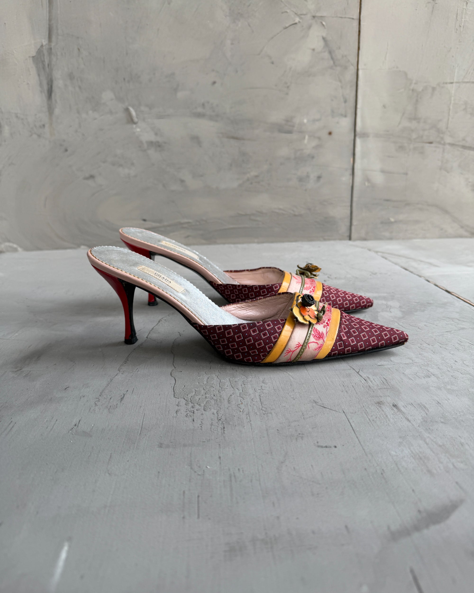 Prada Silk Embellished Kitten Heels – EU 37.5-on a concrete background