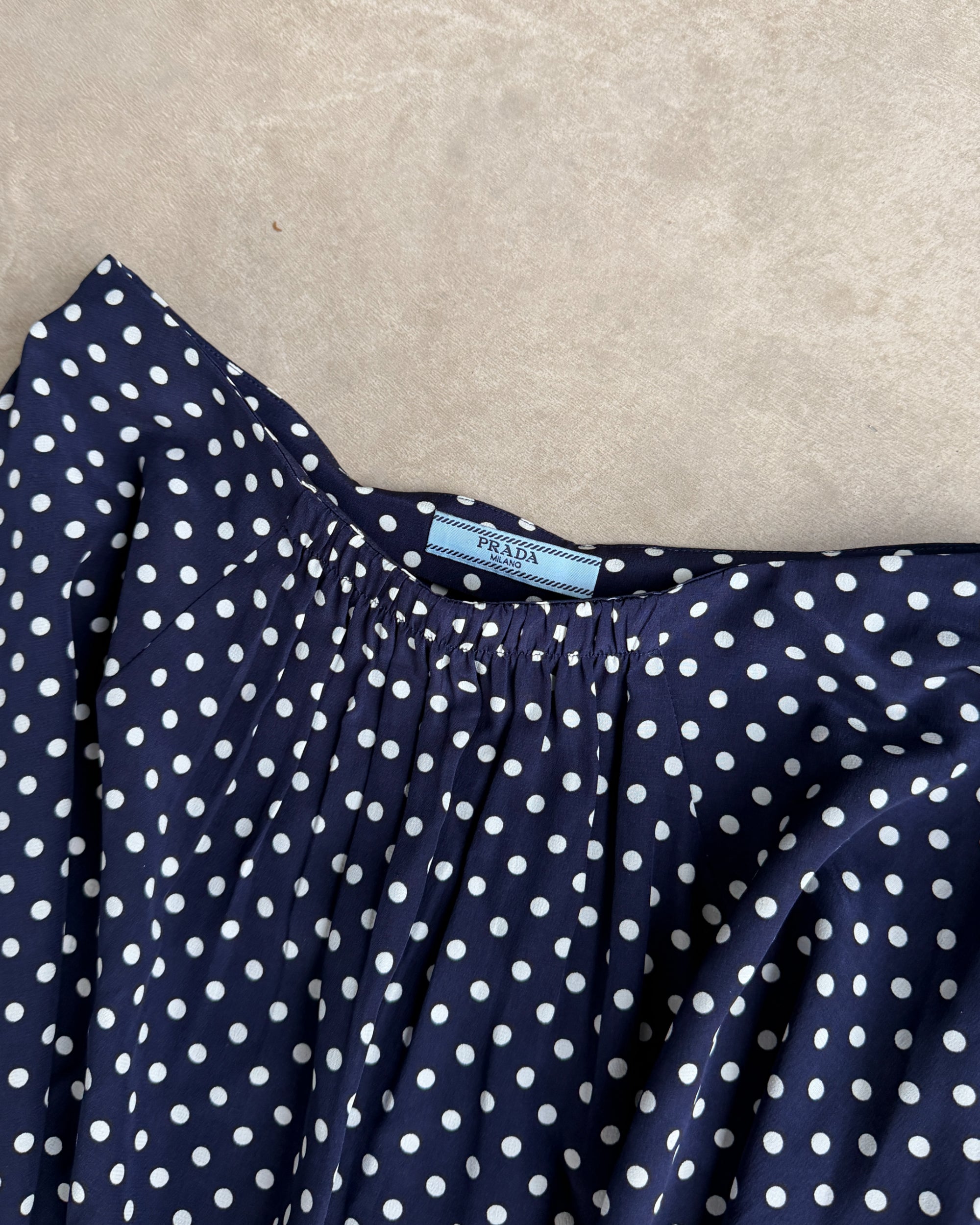 Prada Blue Polka Dot Silk Midi Skirt – S-on a concrete background
