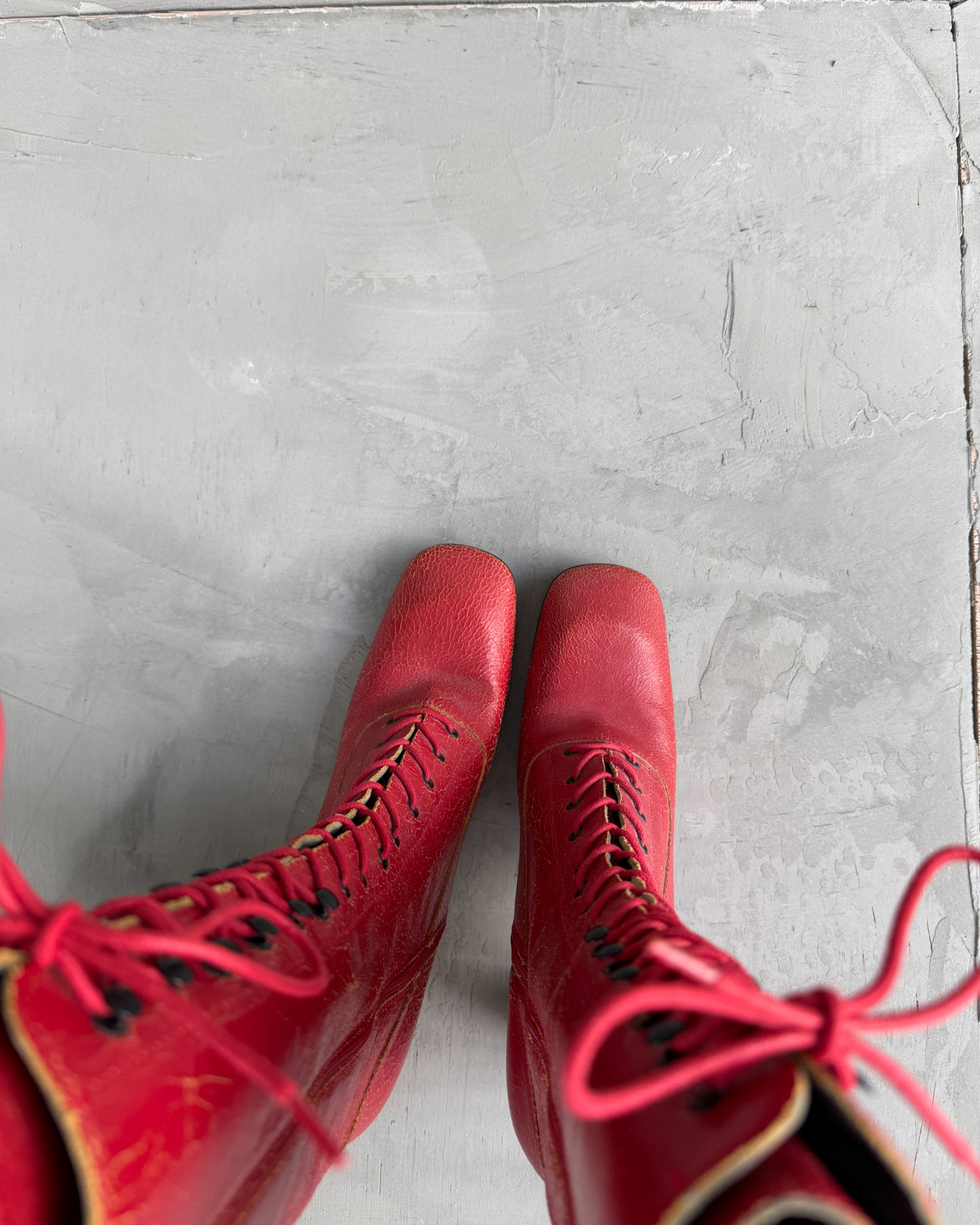 Miu Miu FW01 Cracked Leather Red Lace-Up Boots – EU 38-on a concrete background