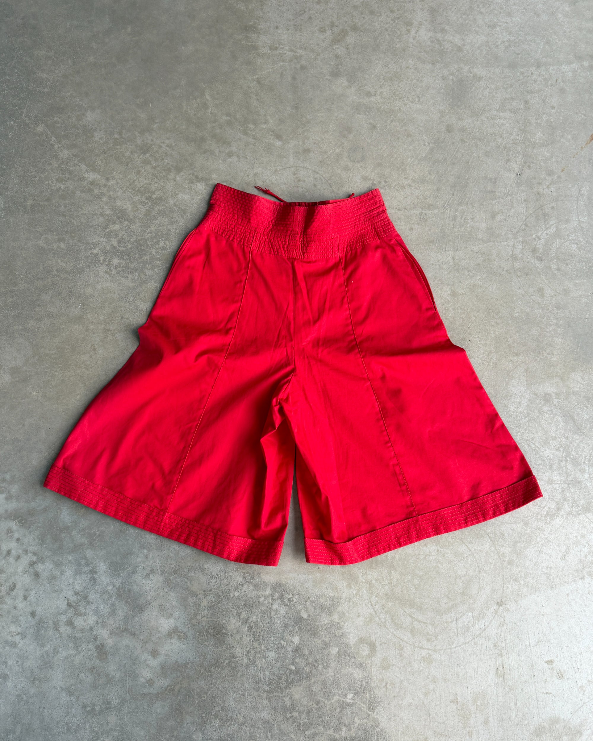 Gianfranco Ferre Cotton Shorts – S-on a concrete background