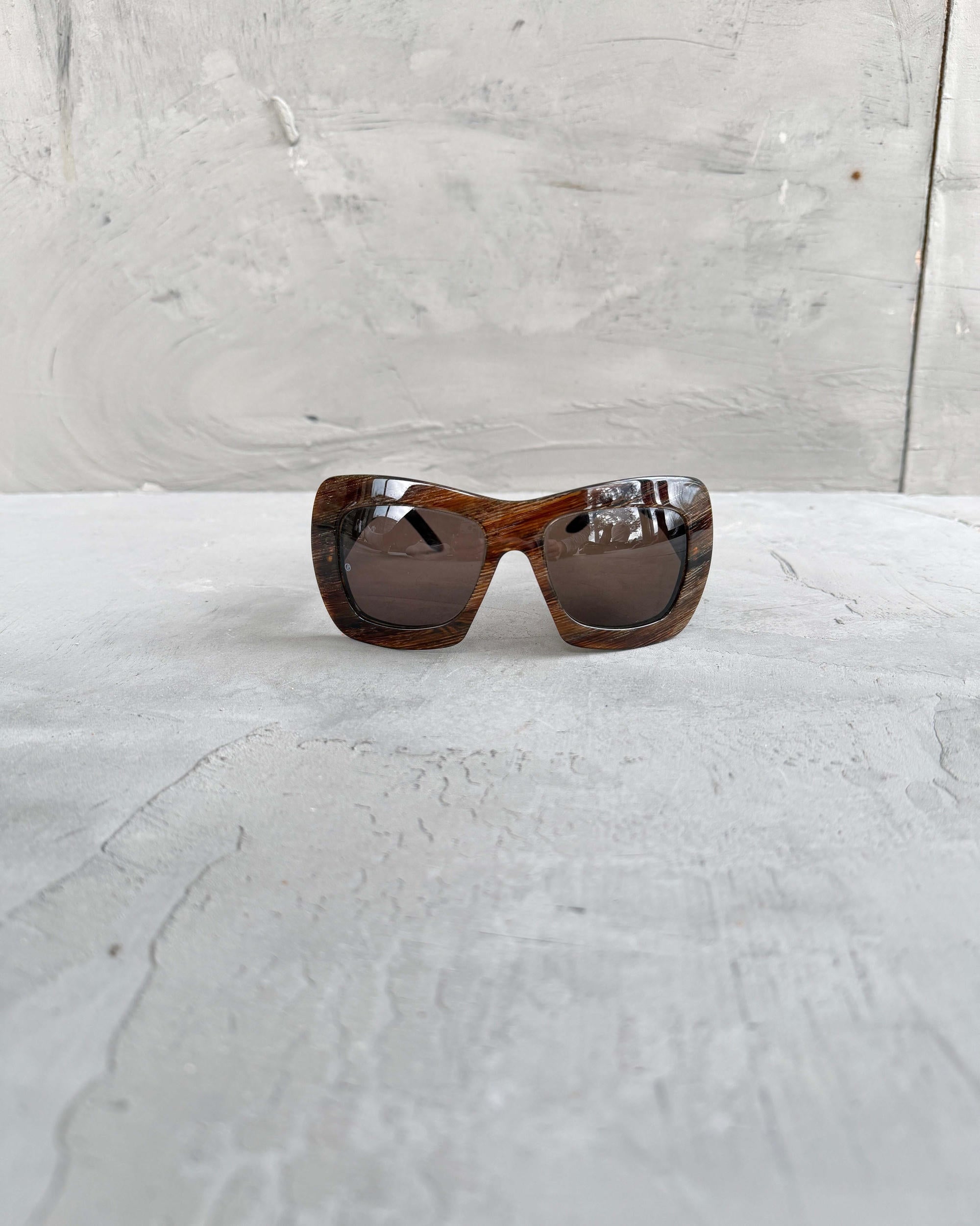 Giorgio Armani Oversized Frame Sunglasses-on a concrete background